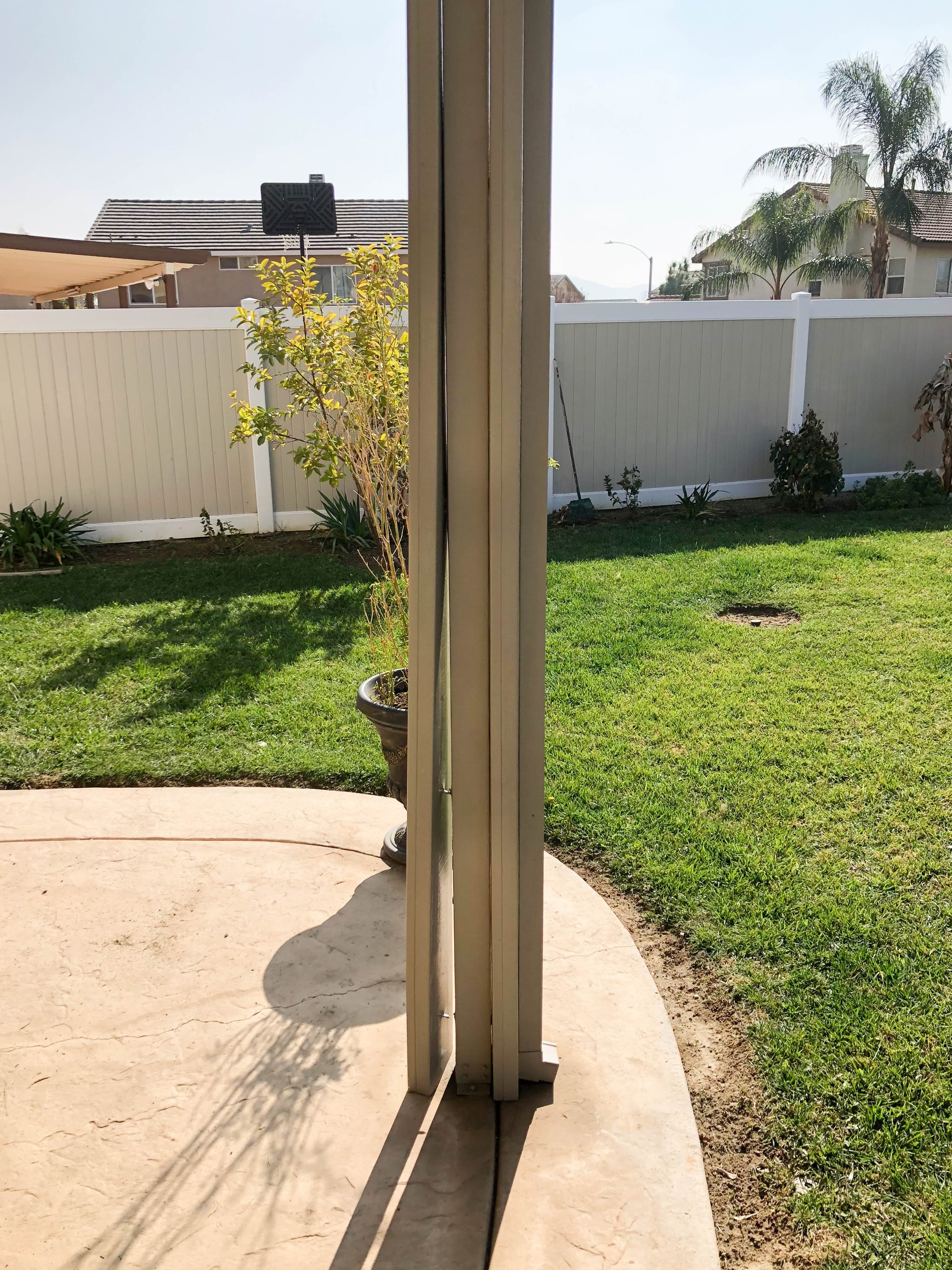 Patio cover post before AlumaBase is installed at the bottom