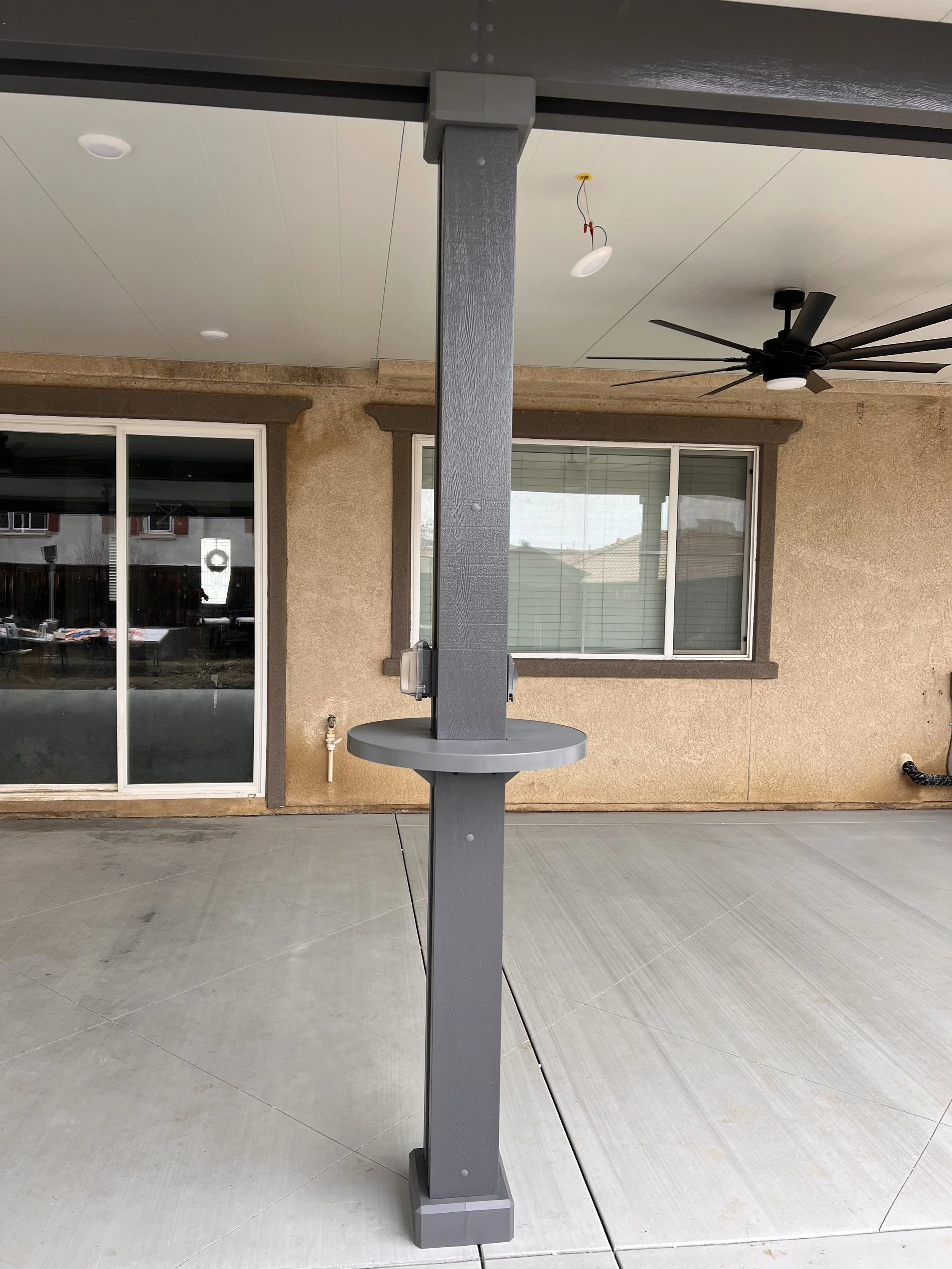 AlumaTable installed on a dark brown Alumawood patio cover