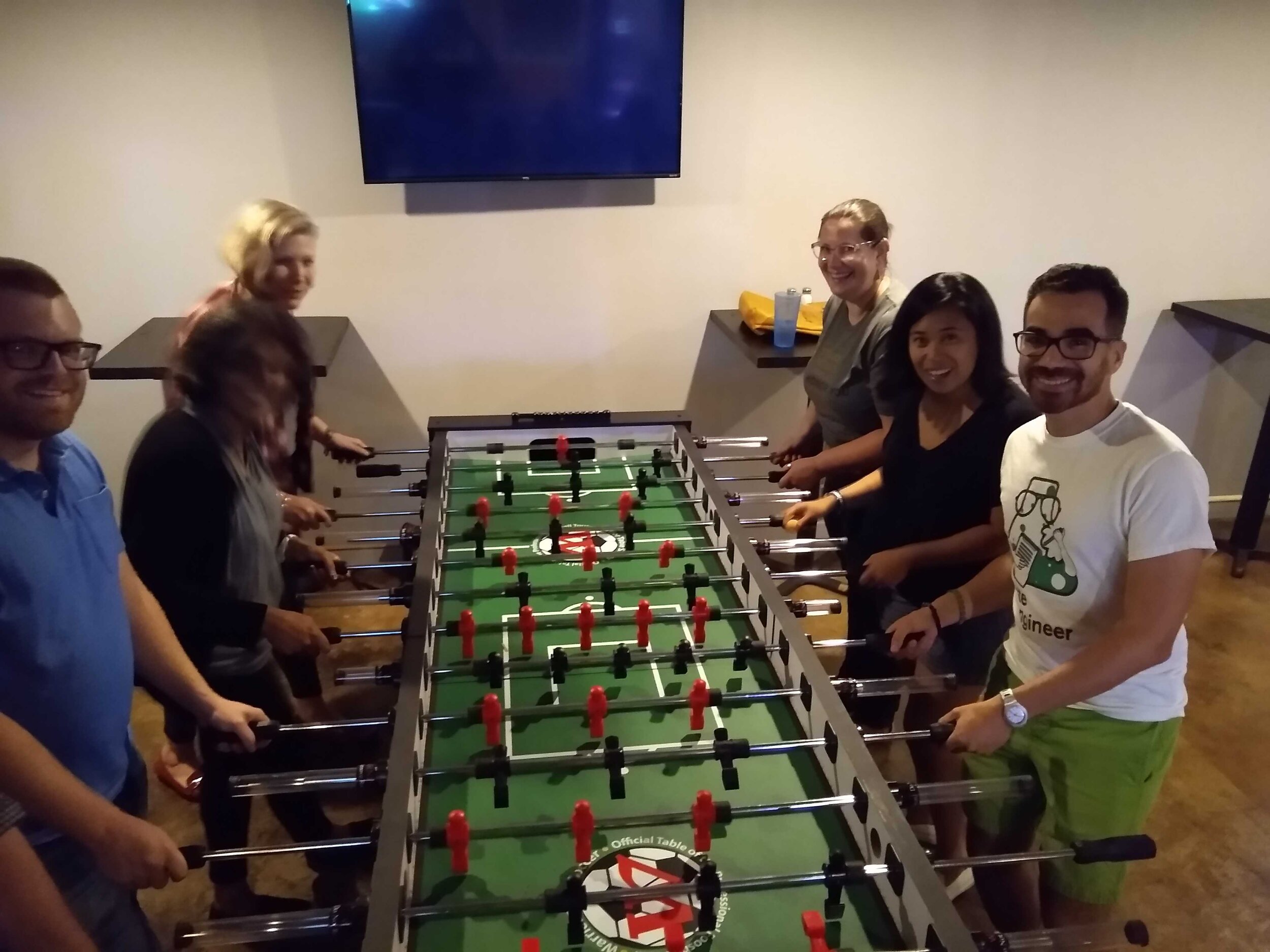  Our teams playing foosball together 