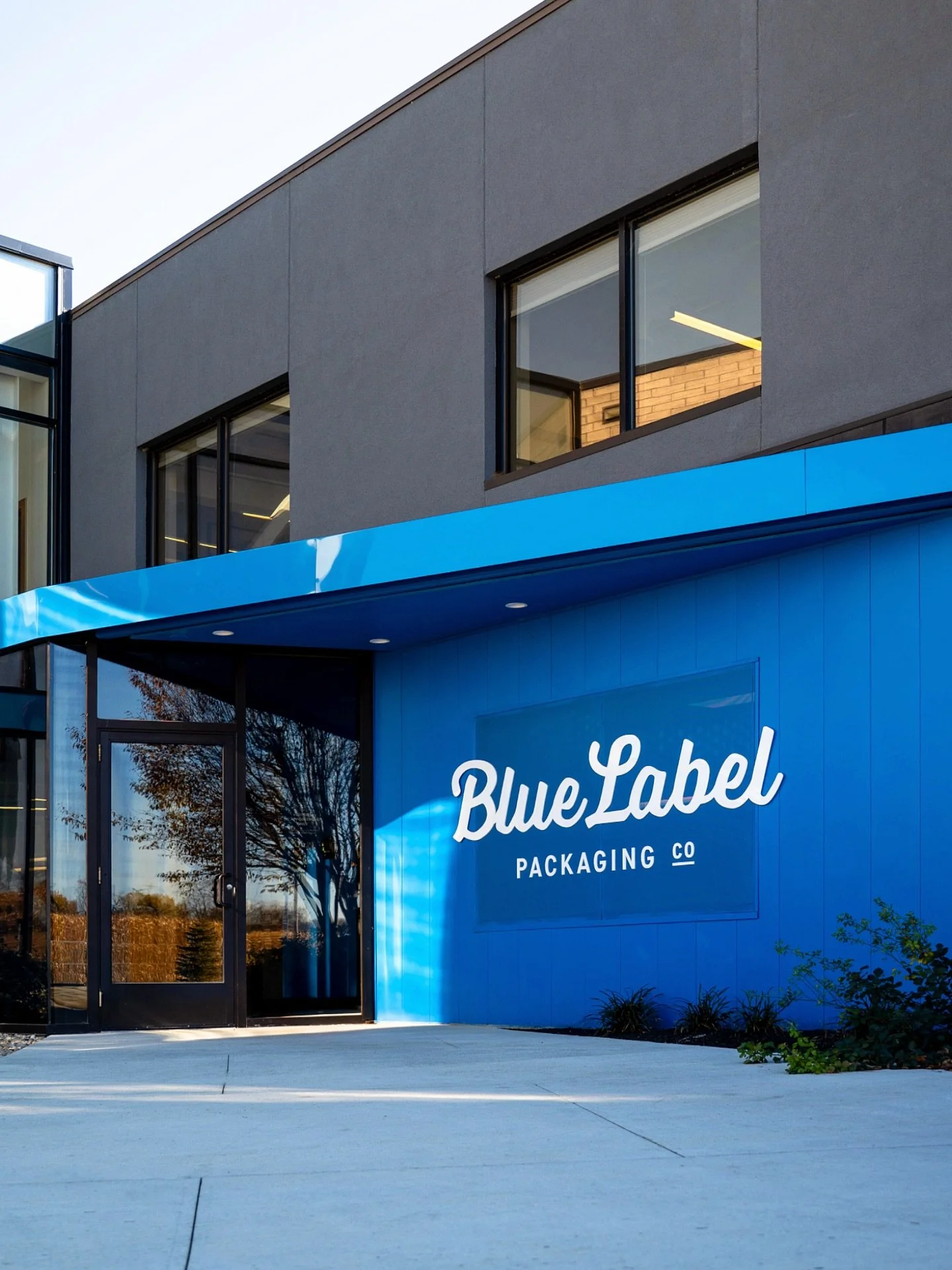 Throwback to some work for one of our longest tenured print partners, @bluelabelpackaging in Lancaster, Ohio. We helped them refresh their logo + brand almost a decade ago now. And gotta say, it looks pretty sharp in their entryway. 💙