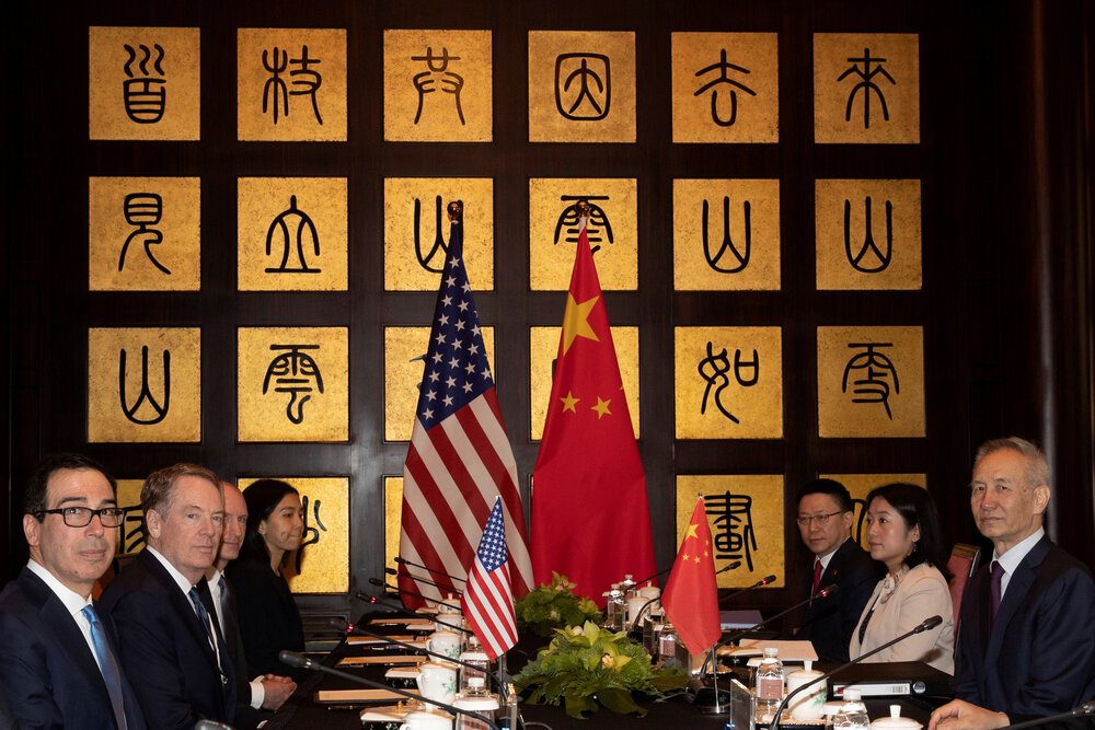 U.S. and Chinese officials, including Chinese Vice Premier Liu He, United States Trade Representative Robert Lighthizer, and Treasury Secretary Steve Mnuchin, meet during negotiations in Shanghai in July 2019. [Ng Han Guan/AFP/Getty Images]