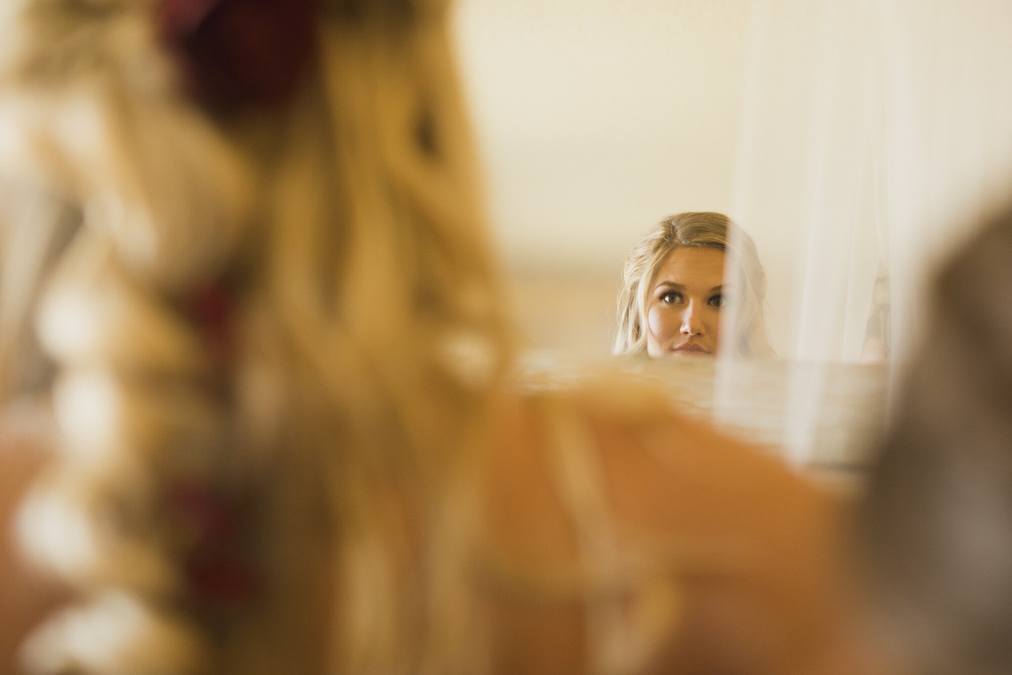 Bliss Photographic_bride looking in mirror.jpg