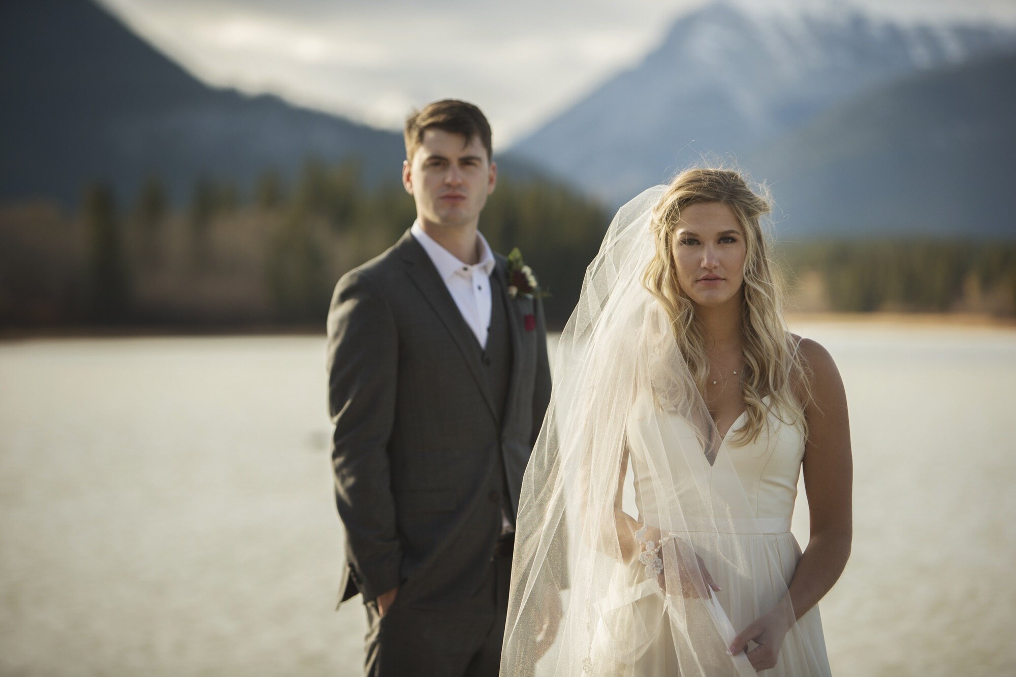bride groom portrait rocky mountain lake canmore.jpg