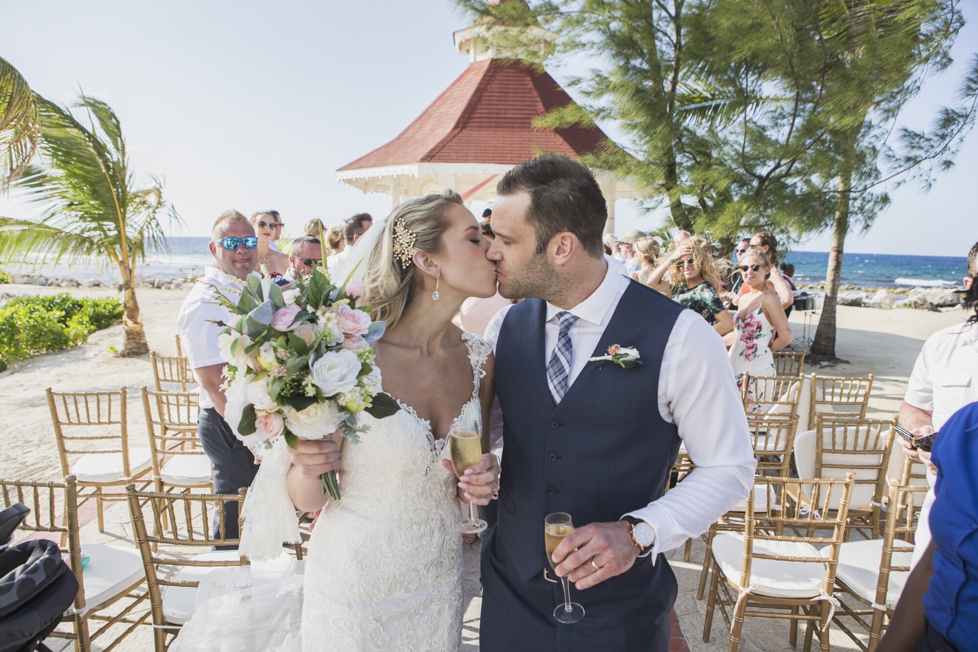 bride and groom kissing beach ceremony.jpg