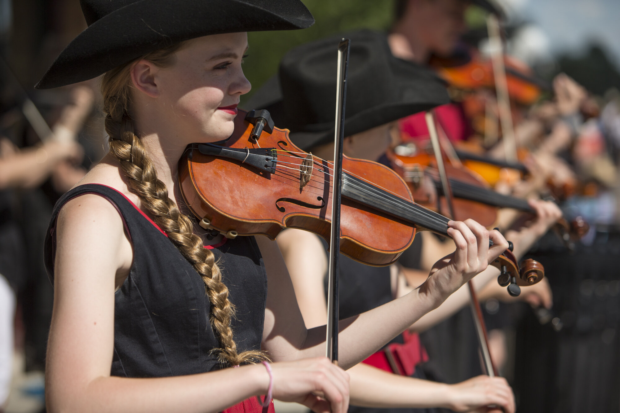calgary event photography bliss photographic young girls playing violins cowboy hats.jpg
