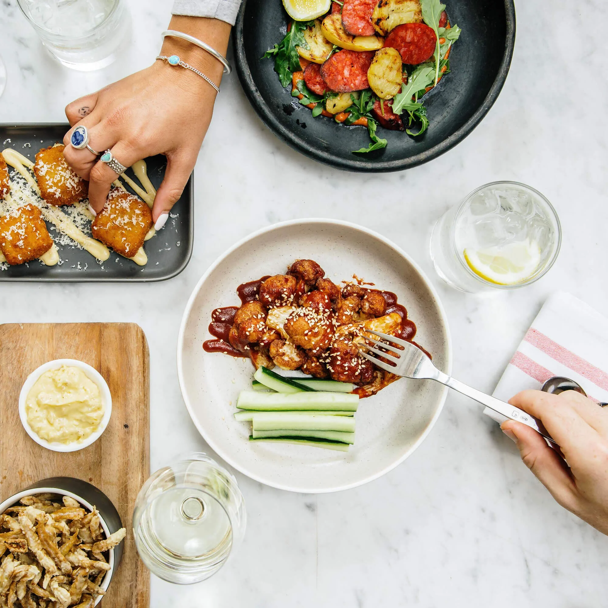 Friends sharing pub food