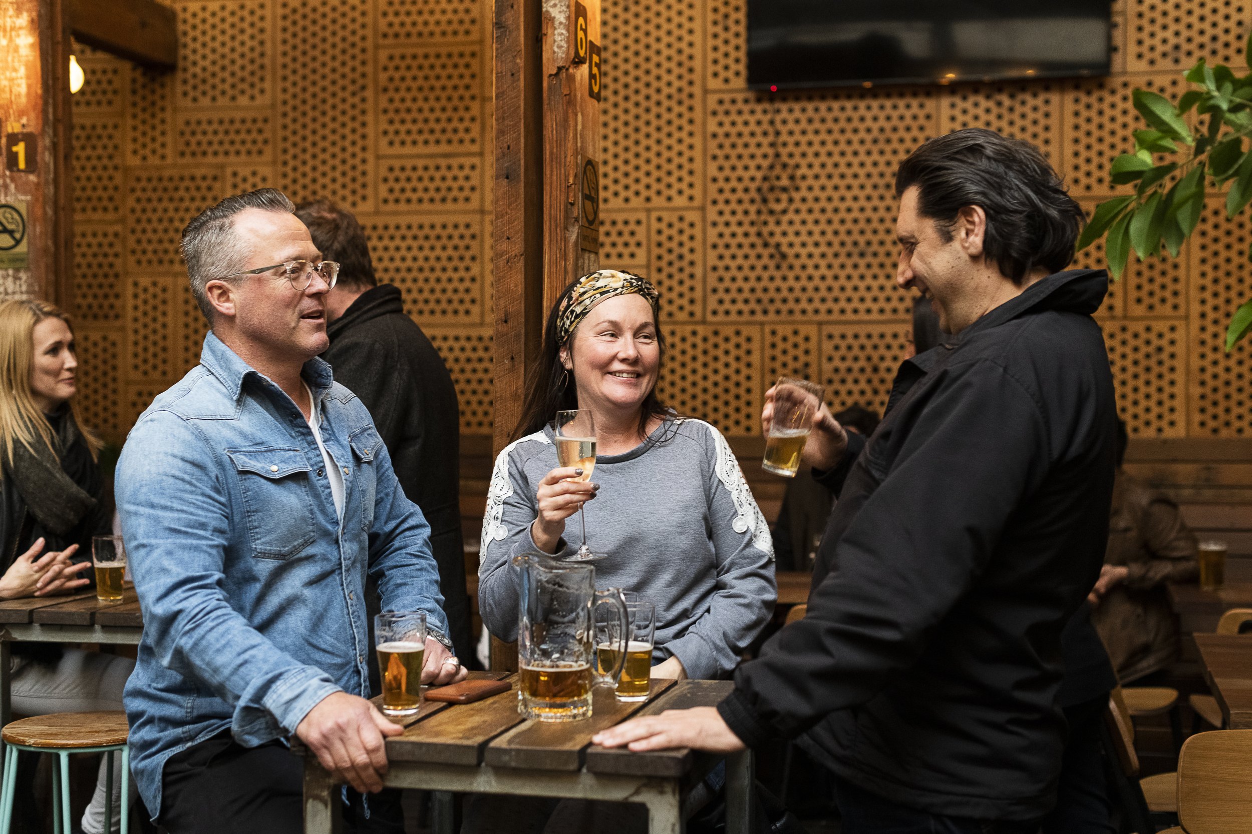 people mingling in abbotsford beer garden at aviary hotel