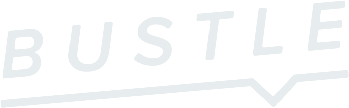 The word "BUSTLE" written in bold white letters with a stylized underline on a black background.