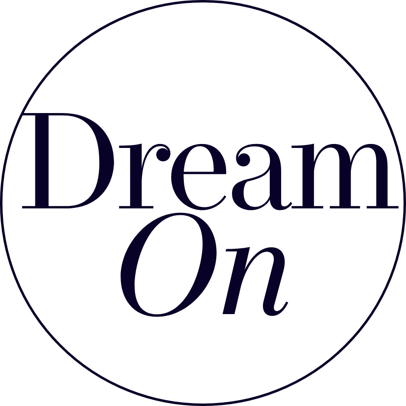 Text surrounded by a circle that reads "Dream On".