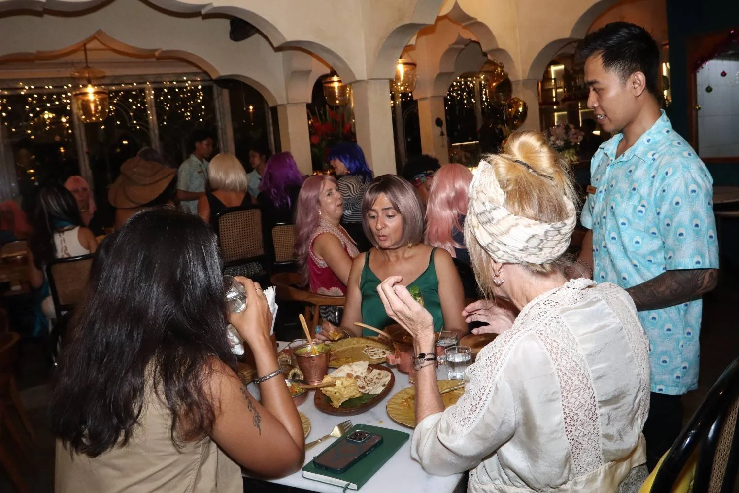 Guests enjoying an authentic Indian dining experience together at Pesona Lounge in Central Ubud.