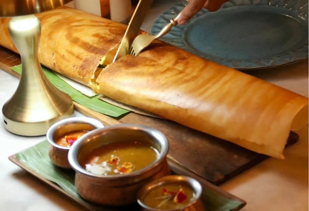 Crispy dosa served with sambar and chutneys at Pesona Lounge Ubud.