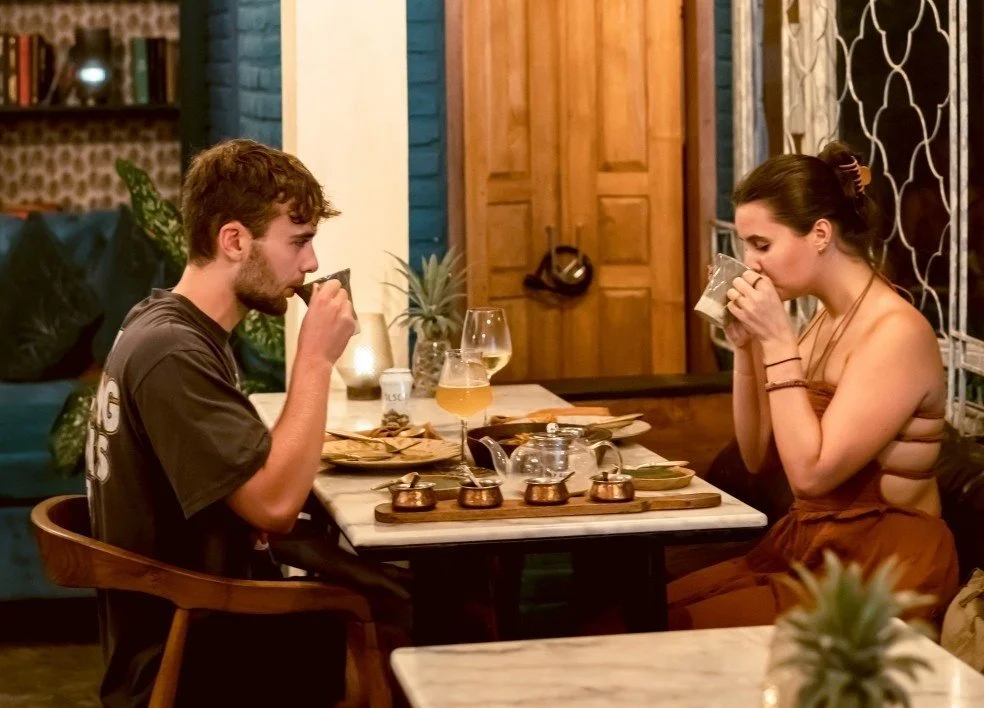 Couple enjoying authentic Indian cuisine during a romantic dinner at Pesona Lounge Ubud.