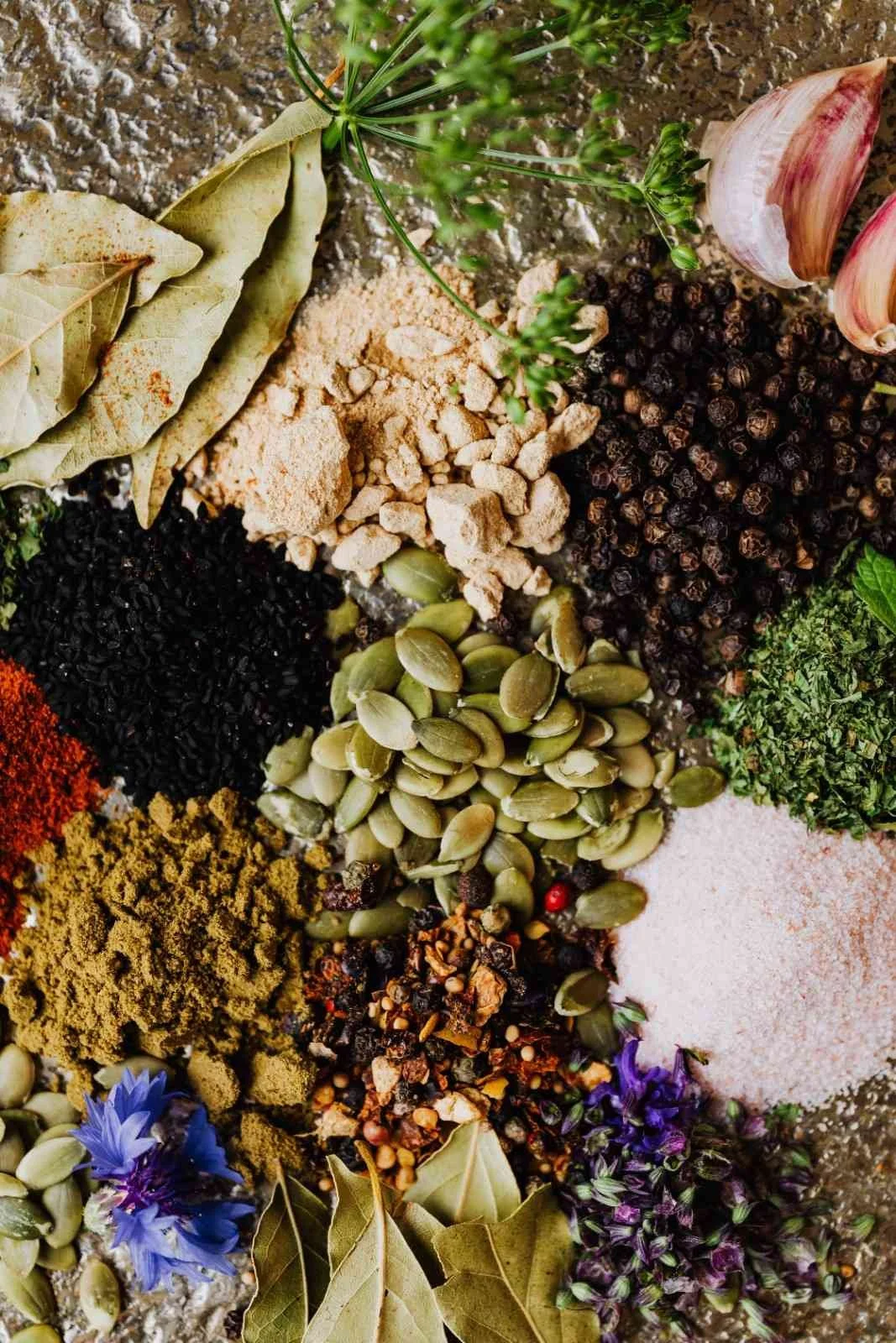 Selection of aromatic Indian spices and herbs used in traditional Indian cooking.