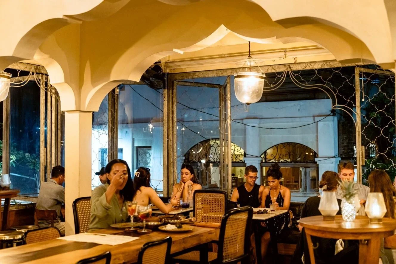 Guests enjoying authentic North Indian dining inside Pesona Lounge Ubud.