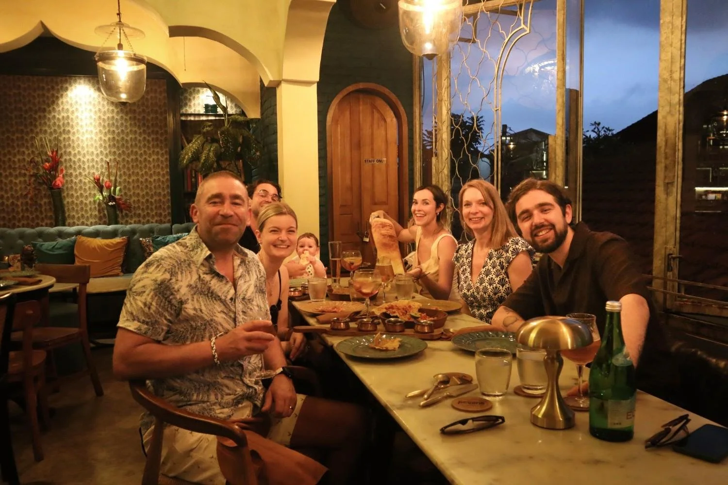 Guests enjoying dinner together at Pesona Lounge in Ubud.
