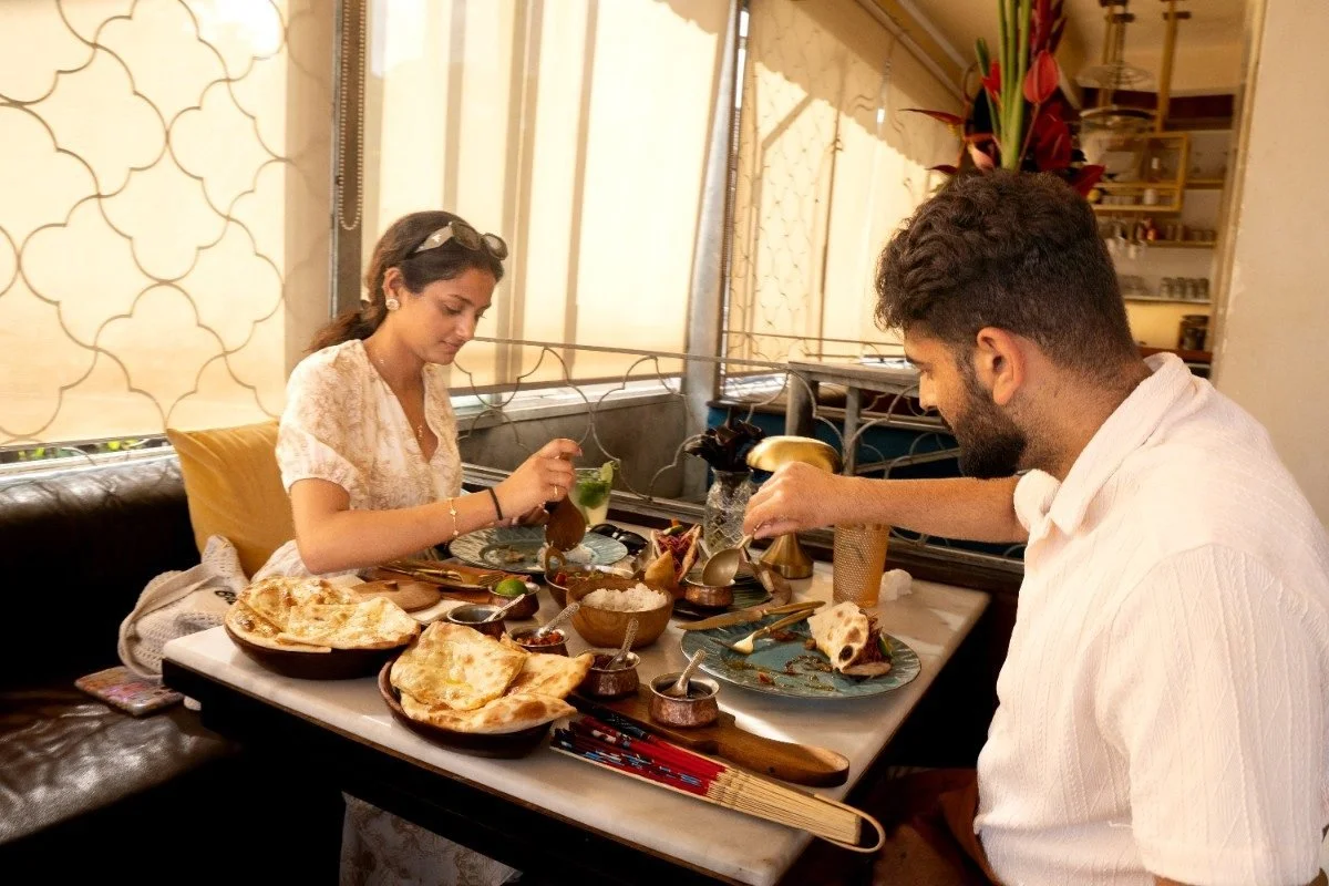 Couple enjoying Indian cuisine at Pesona Lounge Ubud