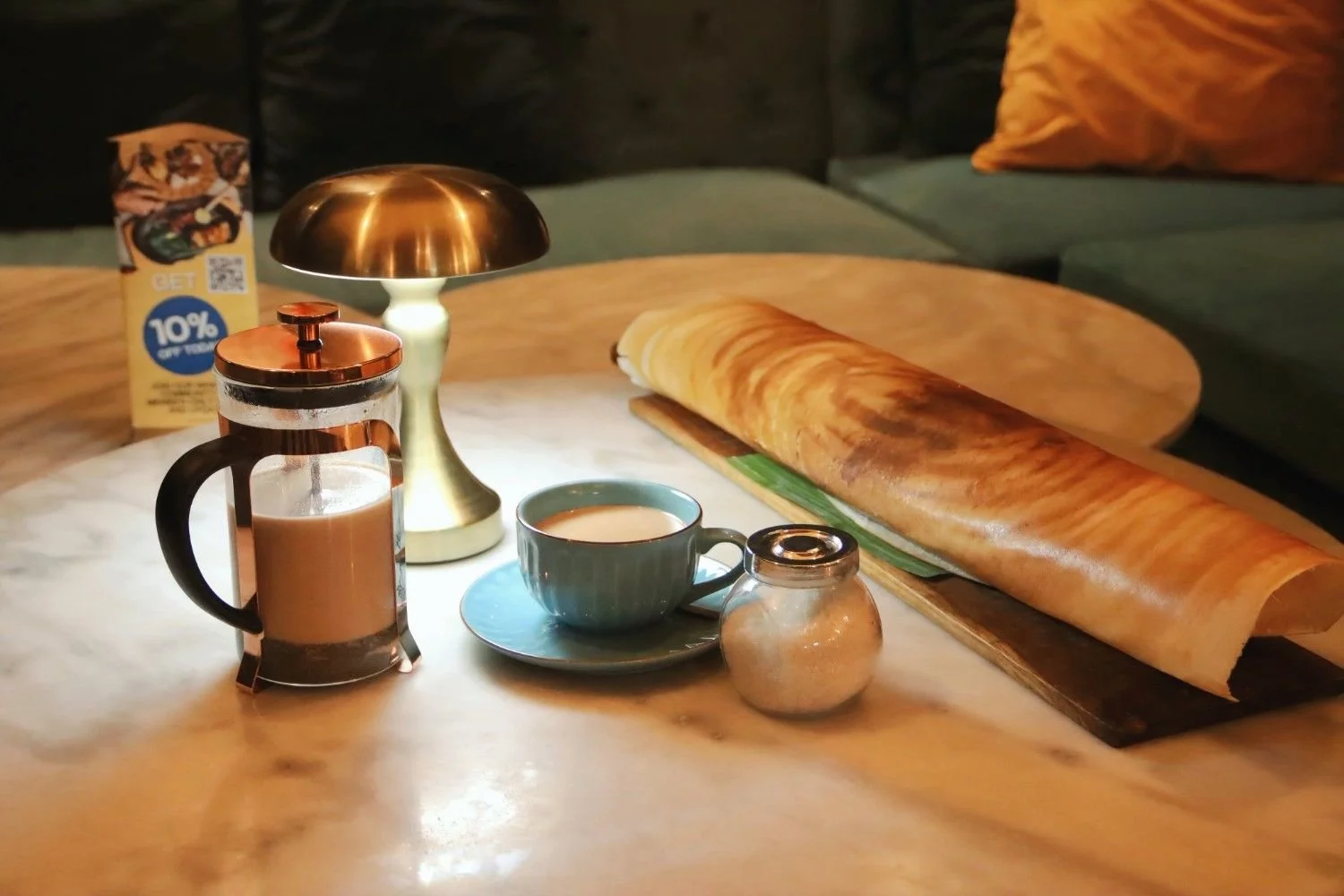 Biggest dosa in Ubud served with Indian chai on table