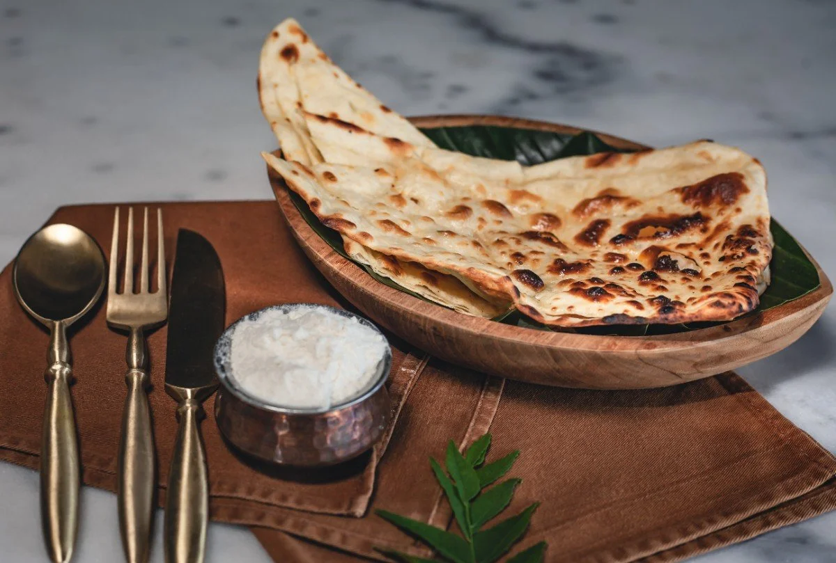 soft buttery naan side with cooling yogurt