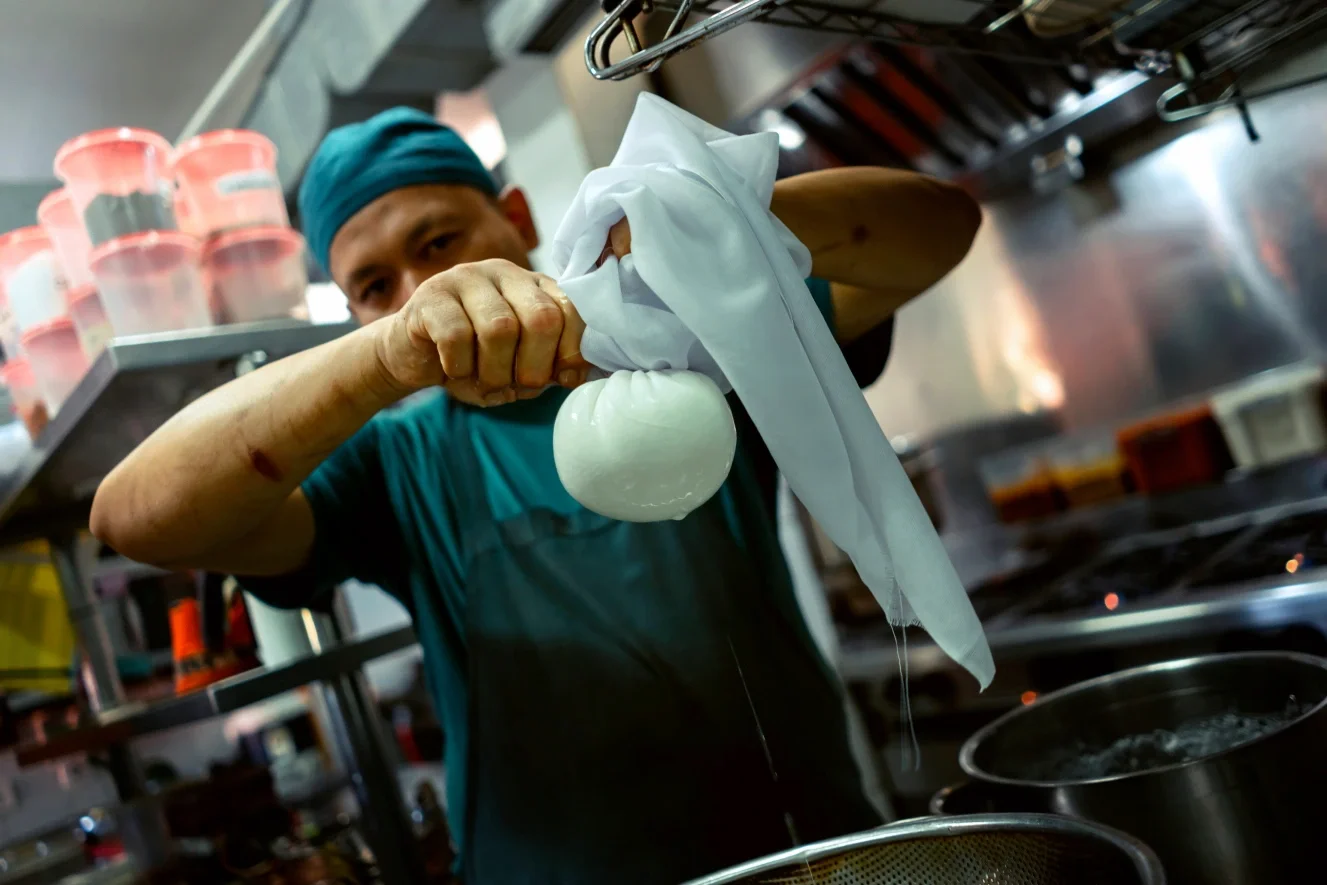 chef preparing indian cheese, paneer cheese