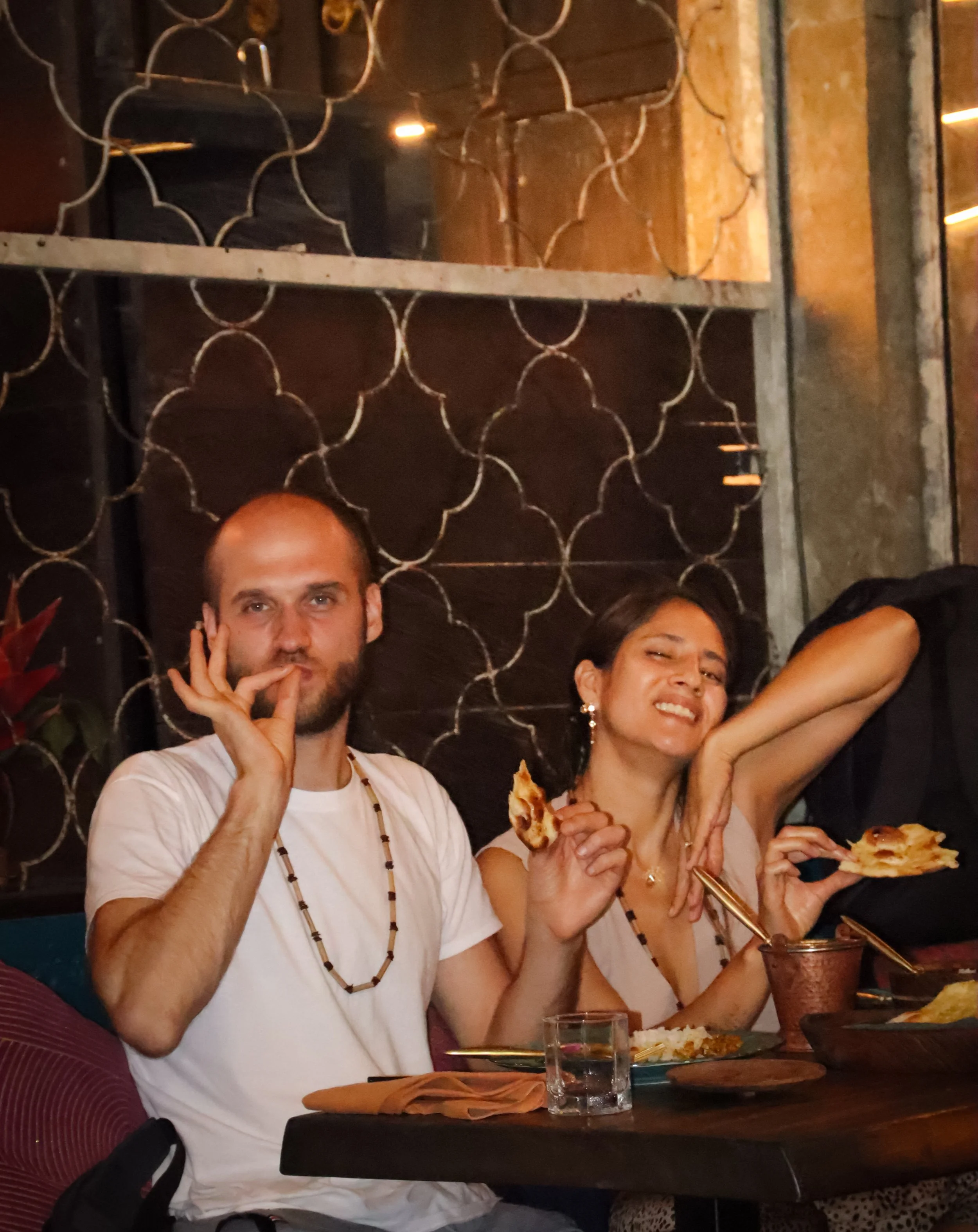 a couple enjoying their roamntic dinner time with the best indian food in Ubud