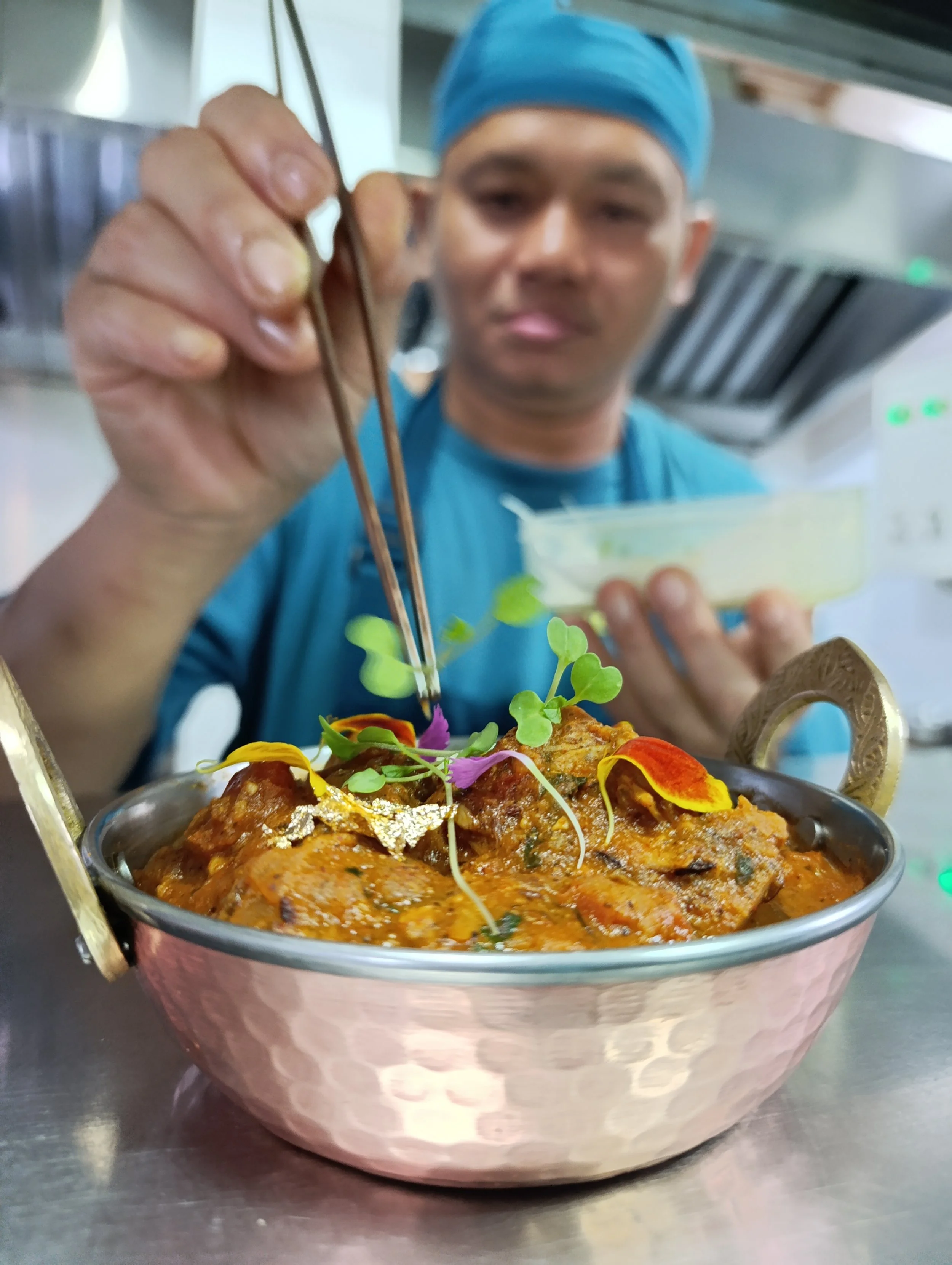 chef preparing authentic indian curry