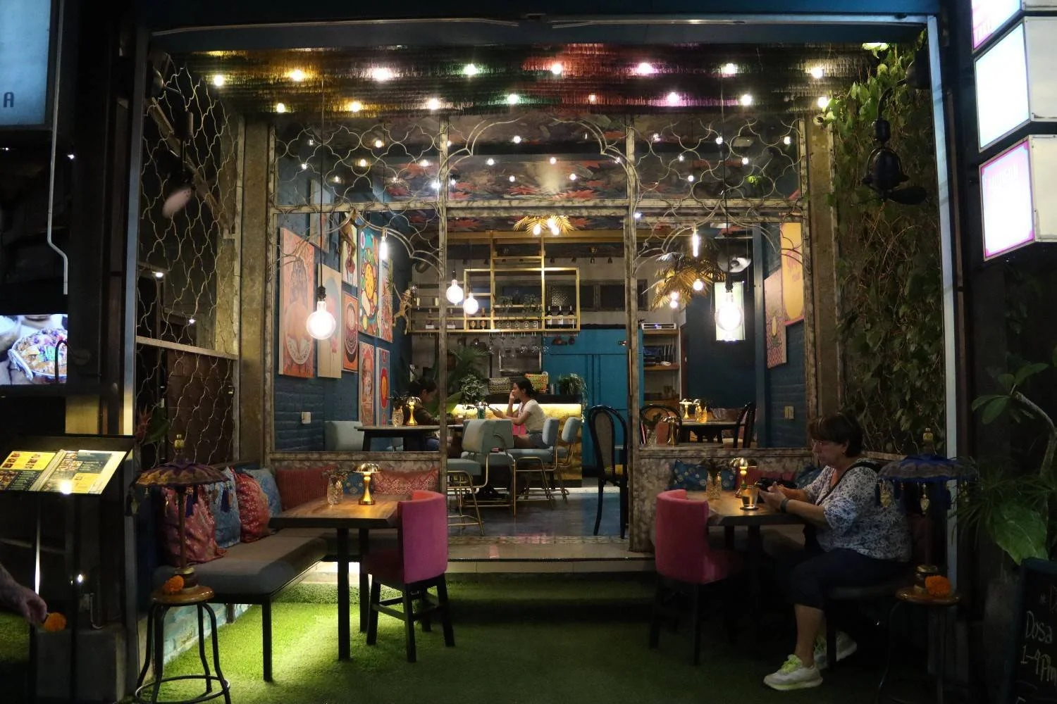 Cozy restaurant ambience in Ubud during the evening with warm lighting.