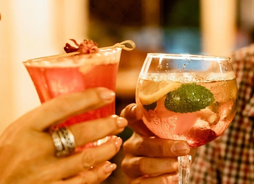 Guests toasting signature cocktails during an evening out in Central Ubud.