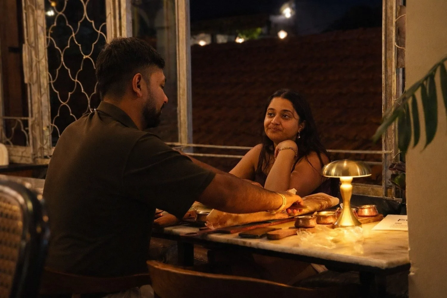 Couple enjoying gluten-friendly Indian food at Pesona Lounge, an Indian restaurant in Ubud.