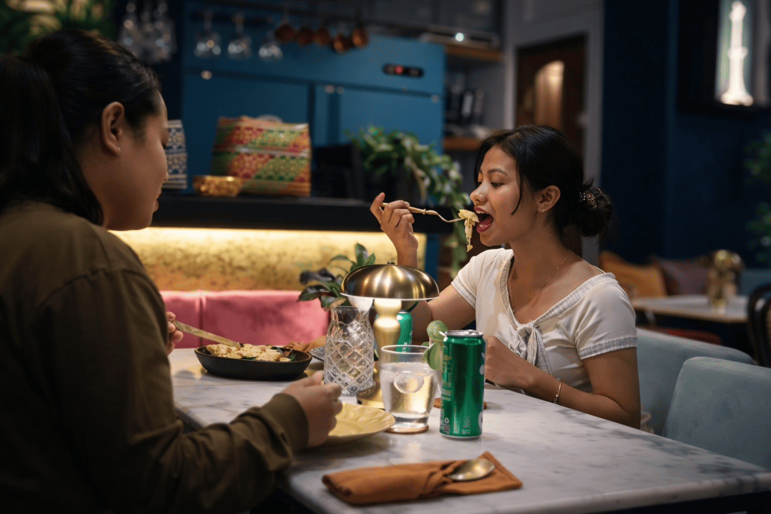 two best friend enjoying warm delicous garlic naan