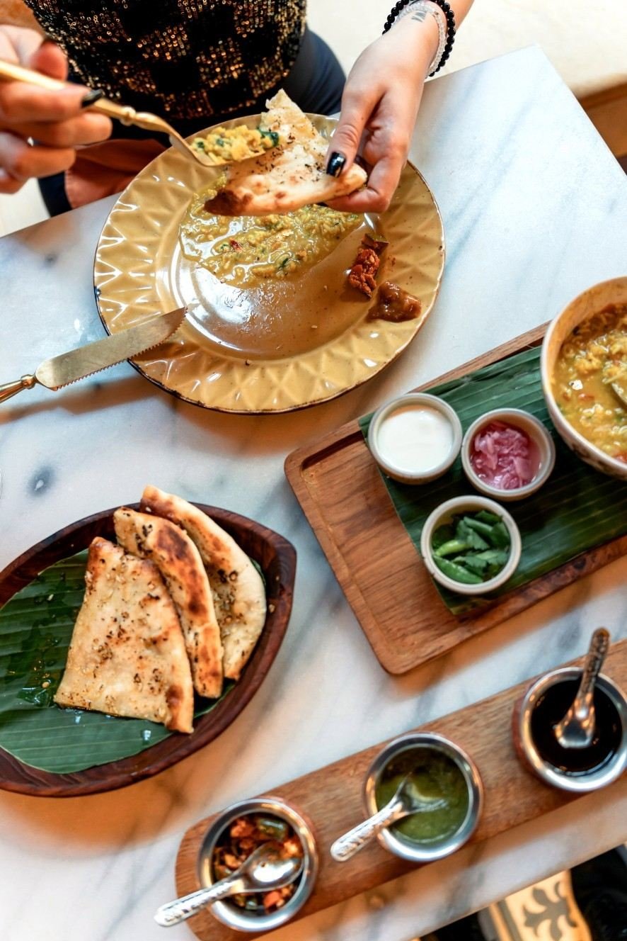 Authentic Indian dishes served with freshly baked naan at Pesona Lounge, an Indian restaurant in Ubud.
