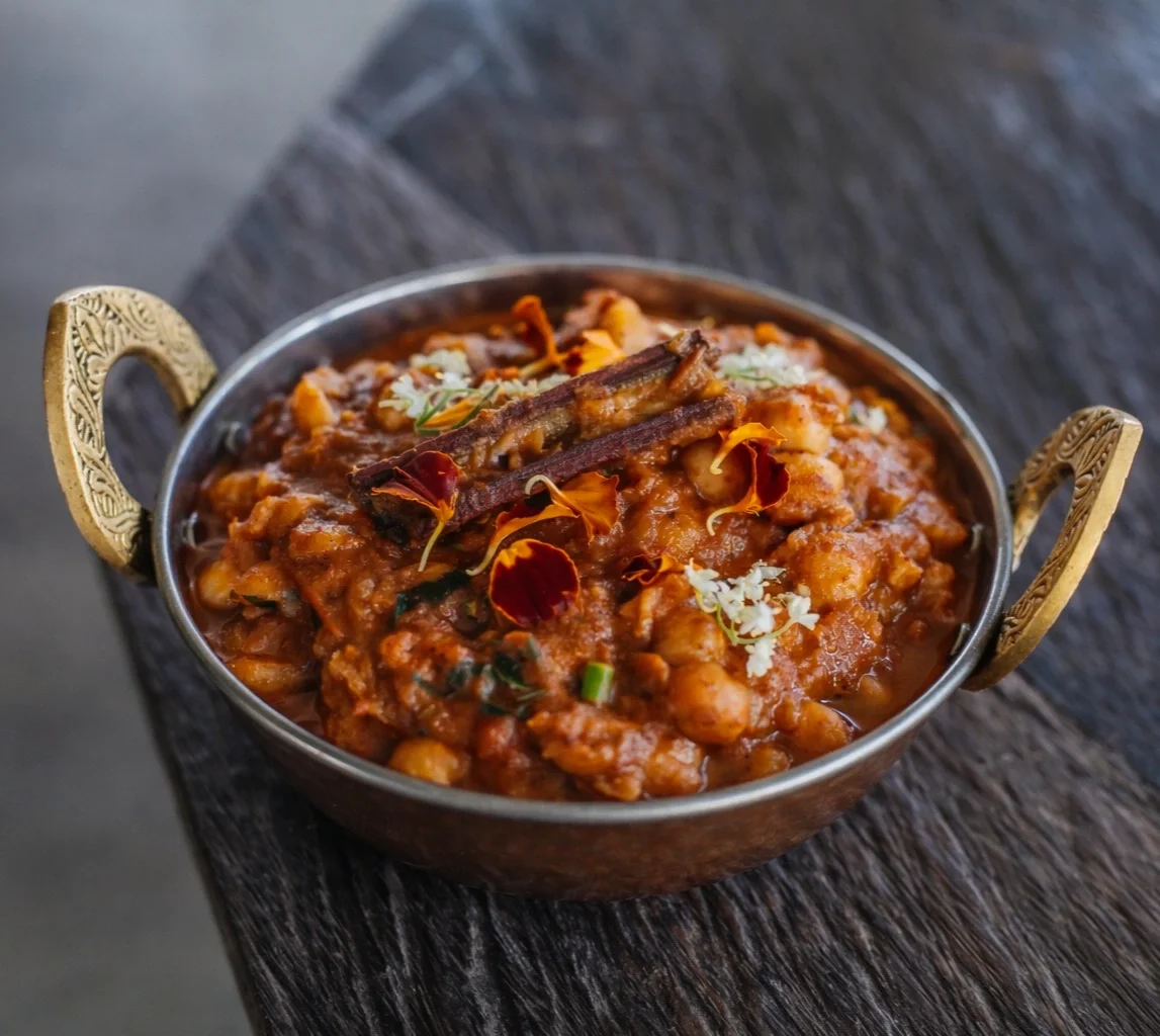 Traditional Chole Masala made with chickpeas simmered in aromatic Indian spices at an Indian restaurant in Ubud.