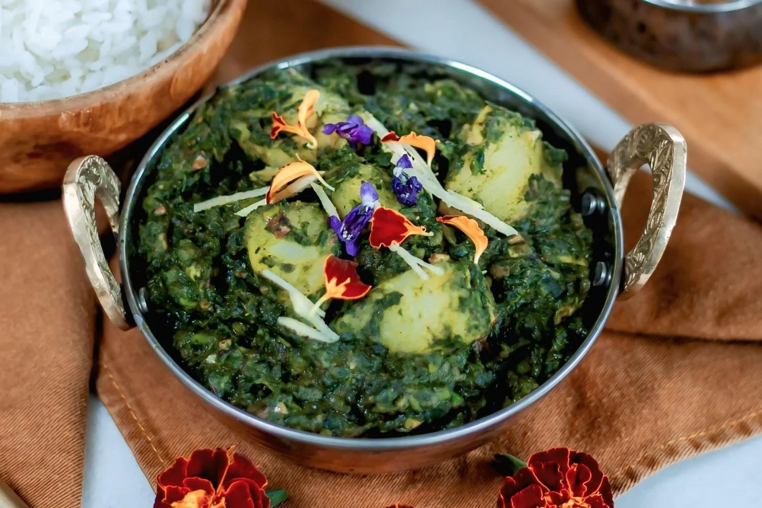 Vegetarian Saag Aloo with spinach and potatoes served at Pesona Lounge Ubud.