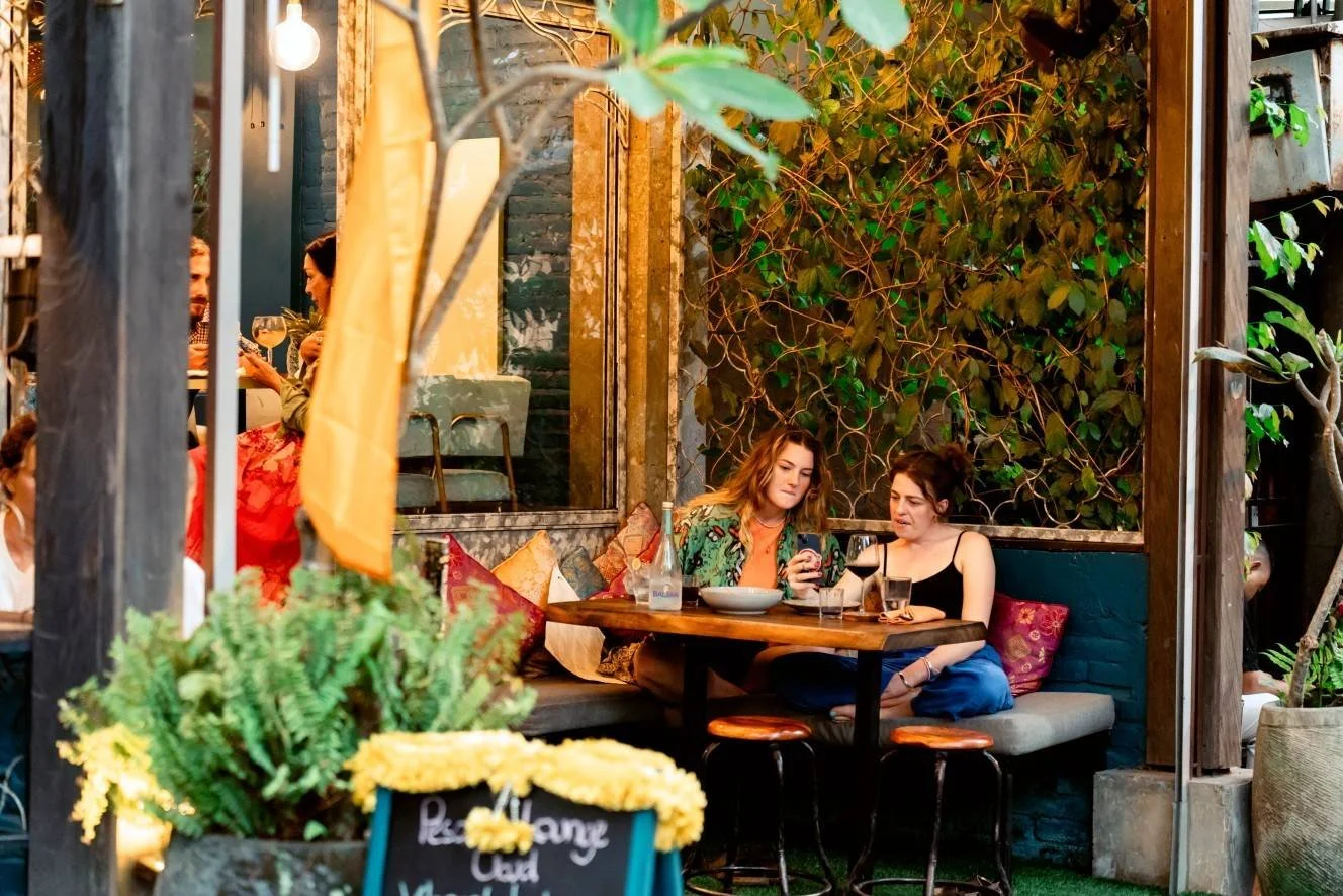 Friends enjoying dinner at pesona lounge ubud