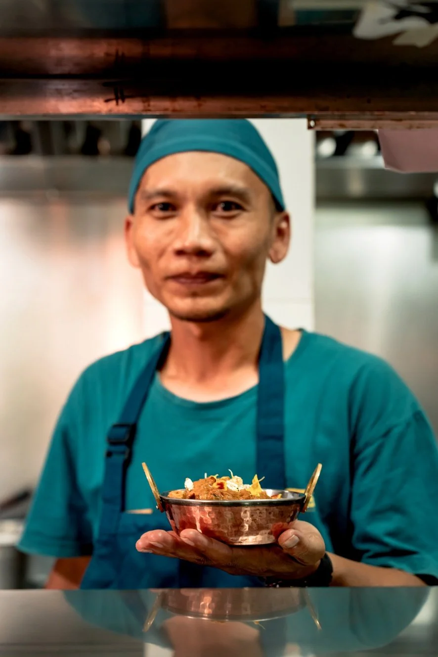 chef showing his masterpiece in front of camera