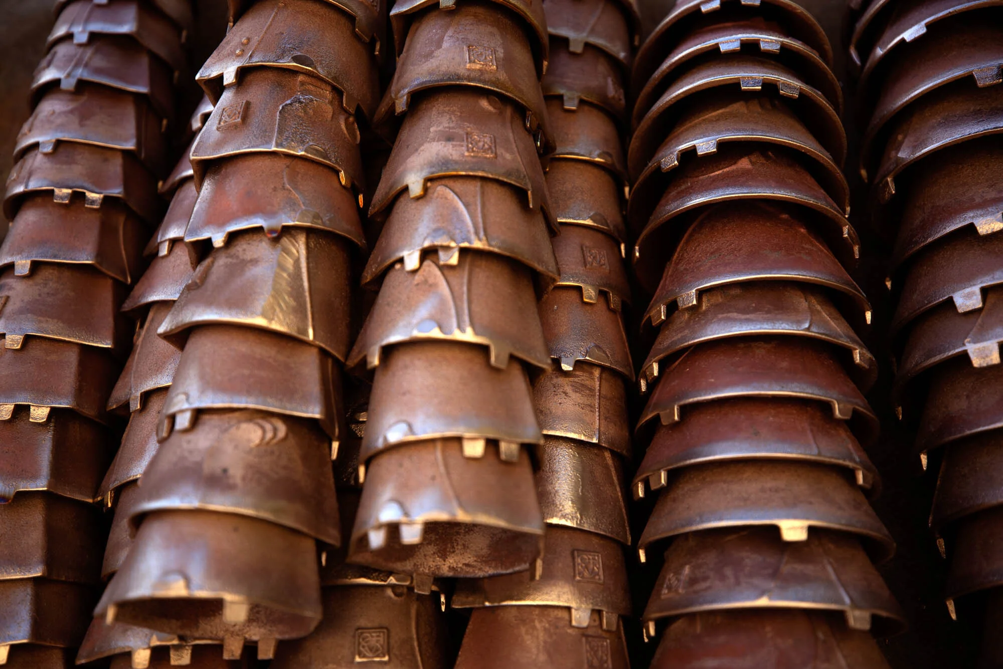 Rows of bronze bells after a long morning of hard labor.