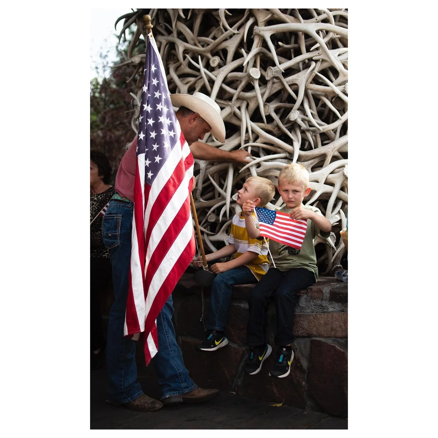 Wade Johnson and his sons, Jude and Jeremiah, hold Anerican flags to honor Rylee McCollum, a marine who was killed in a bombing in Afghanistan this September, during McCollum&rsquo;s homecoming on Sept. 10, 2021. for @jhnewsandguide 

(haven&rsquo;t 