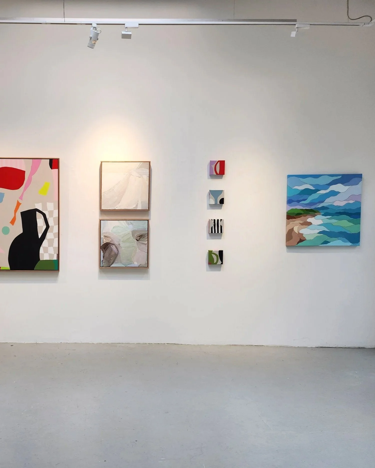 Gallery wall space with abstracgt artworks