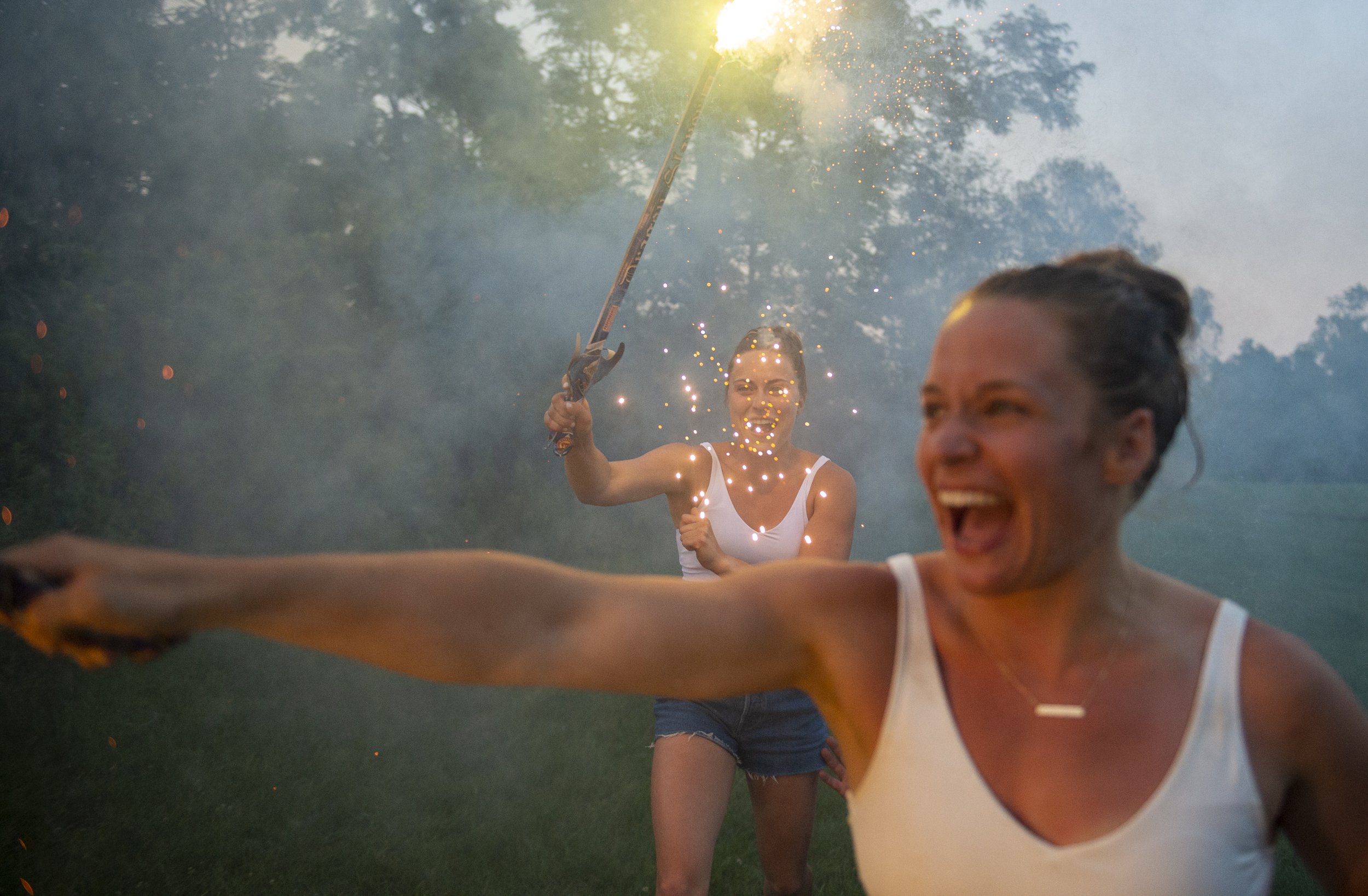  Mikayla Vecchio and Breanne Vodde run with sparklers on July 4, 2021, in Gibsonia, Pa. 