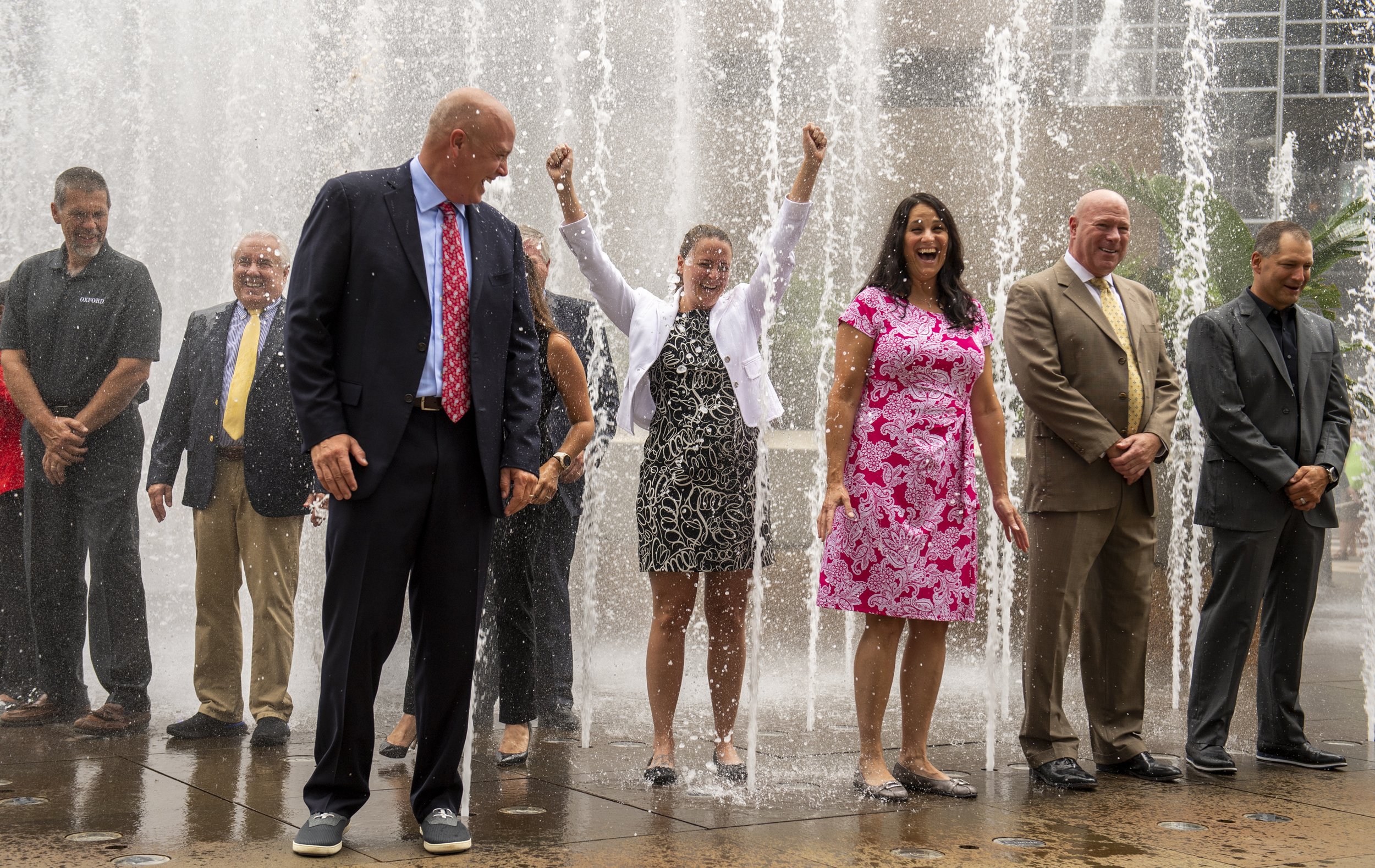  Don Belt stands in front of other executives in the PPG Place fountain during the CEO Soak for ALS (amyotrophic lateral sclerosis) fundraiser on August 12, 2021, in Downtown Pittsburgh, Pa. 