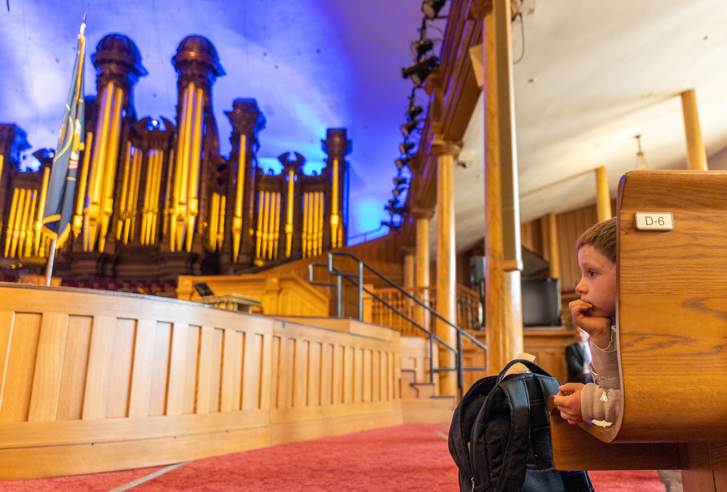  Asher Hausen, 8, lays in Tabernacle while the Mormon Battalion: A Symphonic Saga is performed in Salt Lake City on Sunday, July 24, 2022. 