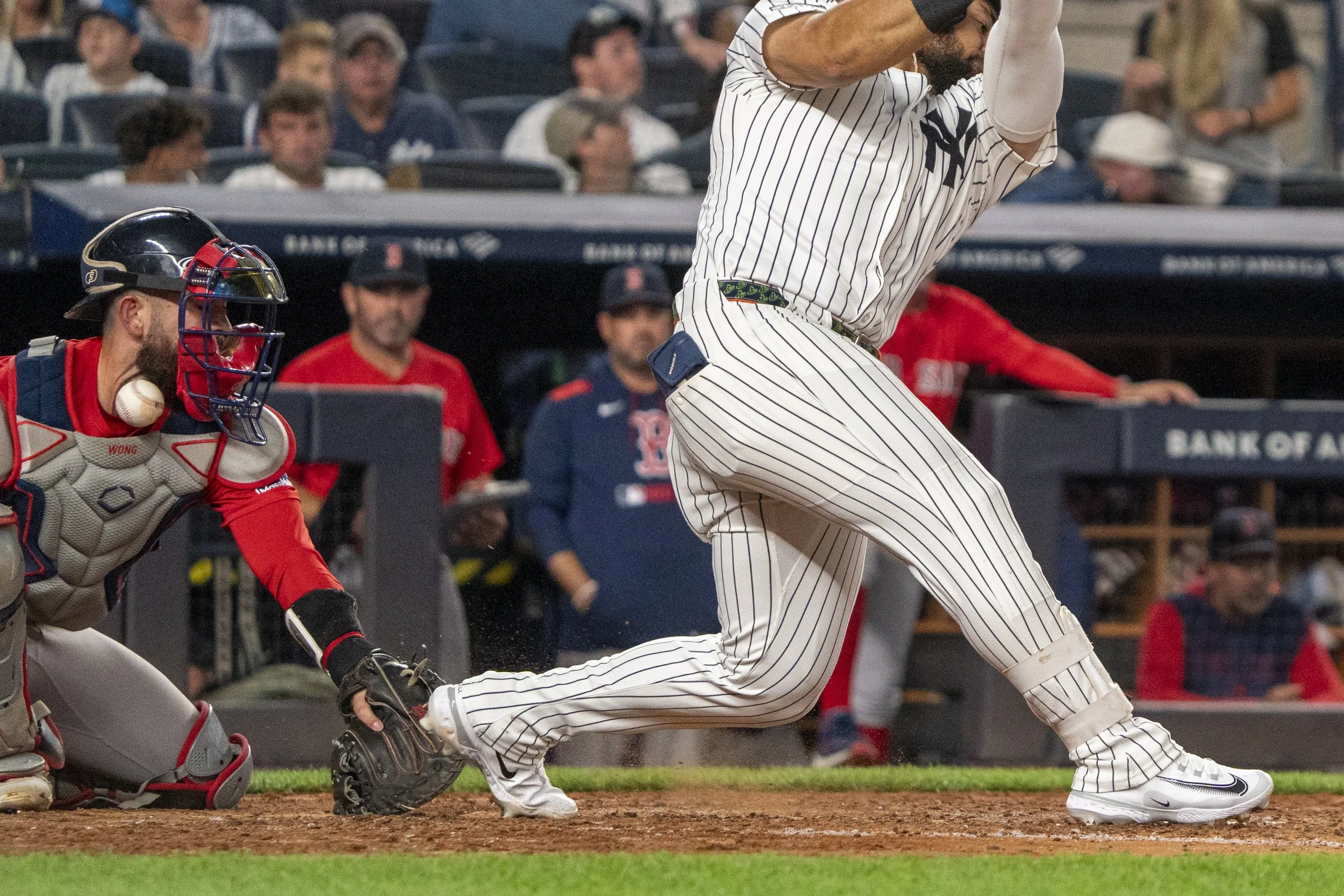  Connor Wong #12 of the Boston Red Sox takes a pitch the neck while playing  the New York Yankees at Yankee Stadium on August 22, 2025 in New York City. The Boston Red Sox won 1-0.  