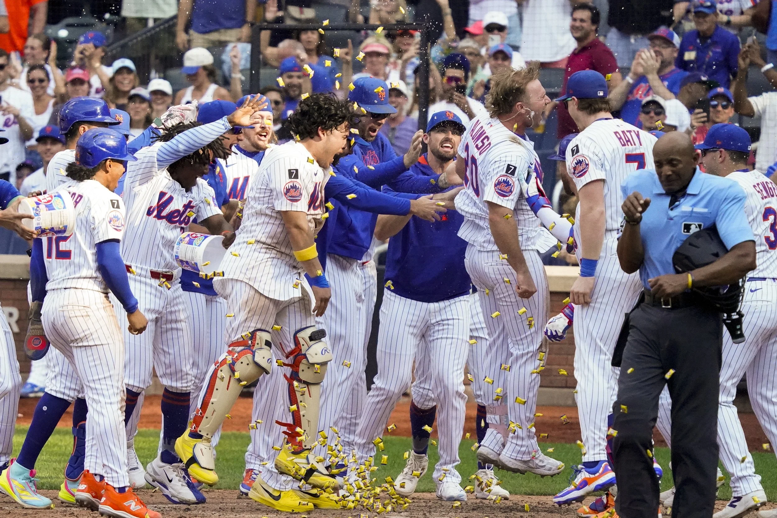  Pete Alonso #20 of the New York Mets heads to home plate to celebrate with teammates after hitting a home run for a walk off win in the bottom of the 10th against the Texas Rangers at Citi Field on September 14, 2025 in New York City. The New York M