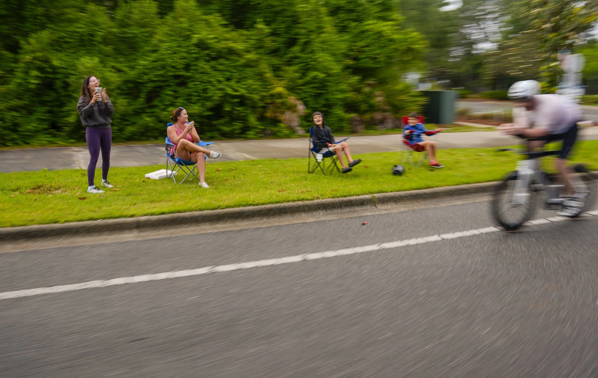  People cheer as an age group athlete races the bike course of the 2026 IRONMAN 70.3 Gulf Coast on May 9, 2026, in Panama City Beach, Florida. (Photo by Benjamin B. Braun/Getty Images for IRONMAN) 