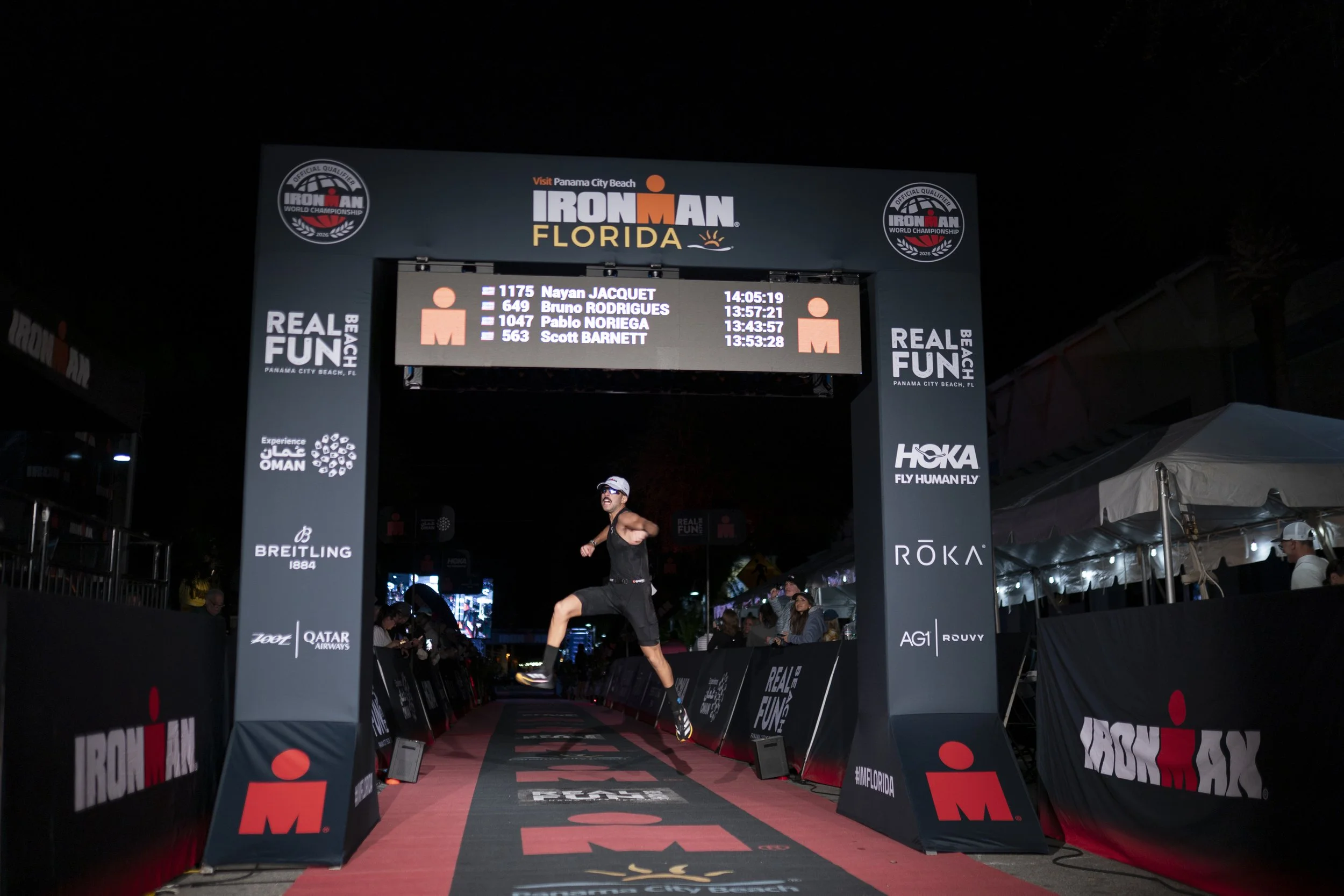   An Age-group athlete finishes the 2025 IRONMAN Florida on November 1, 2025 in Panama City Beach, Florida. (Photo by Benjamin B. Braun/Getty Images for IRONMAN) 