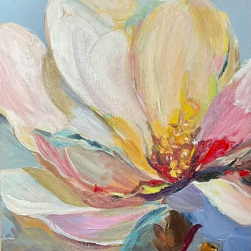 Abstract painting of a flower with pastel pink, yellow, white, and blue petals and a textured yellow center.