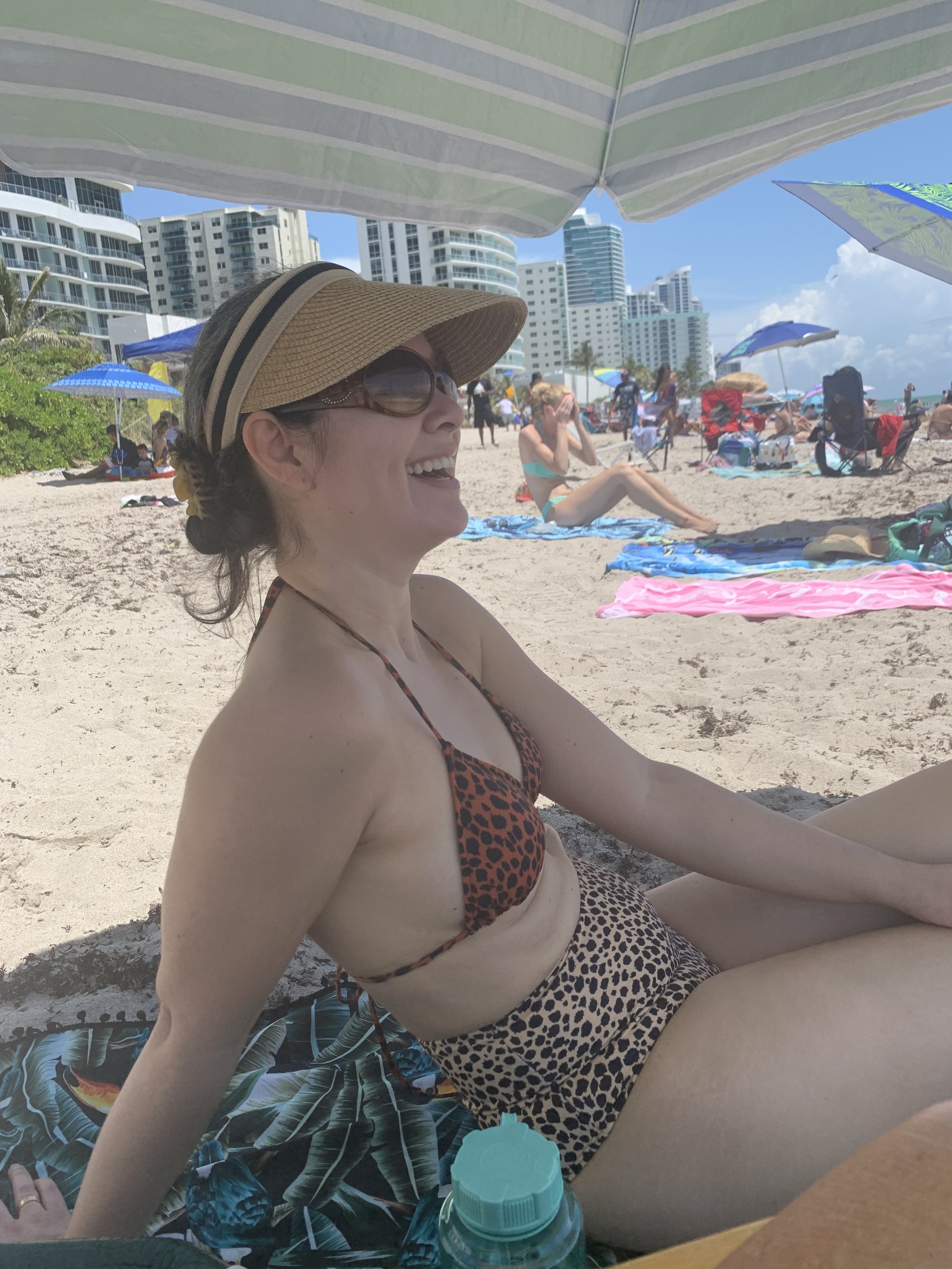 jackie-pesal-under-umbrella-beach