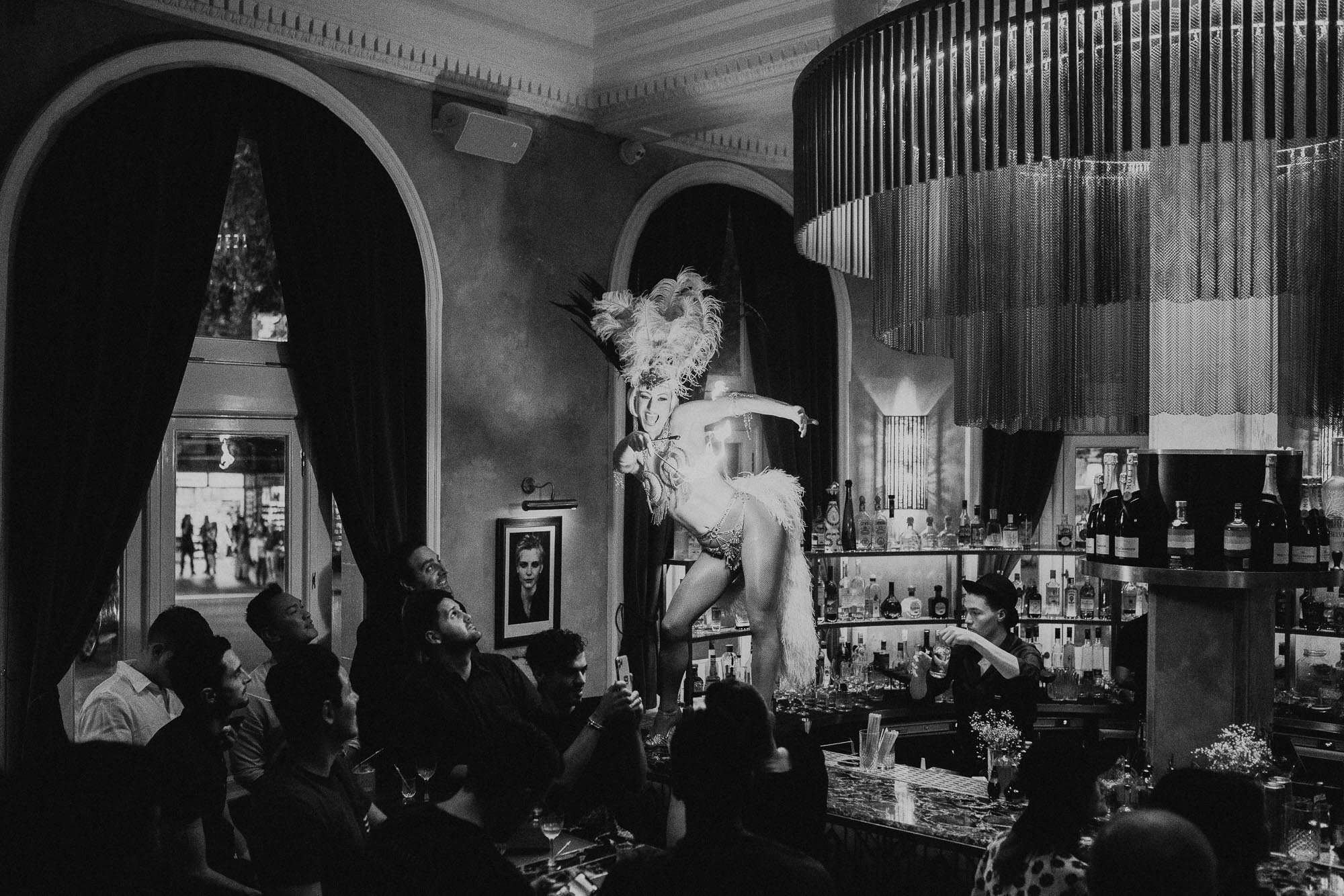 Photo of a Burlesque dancer on a bar during a Great Gatsby Style Party at The Cat's Meow