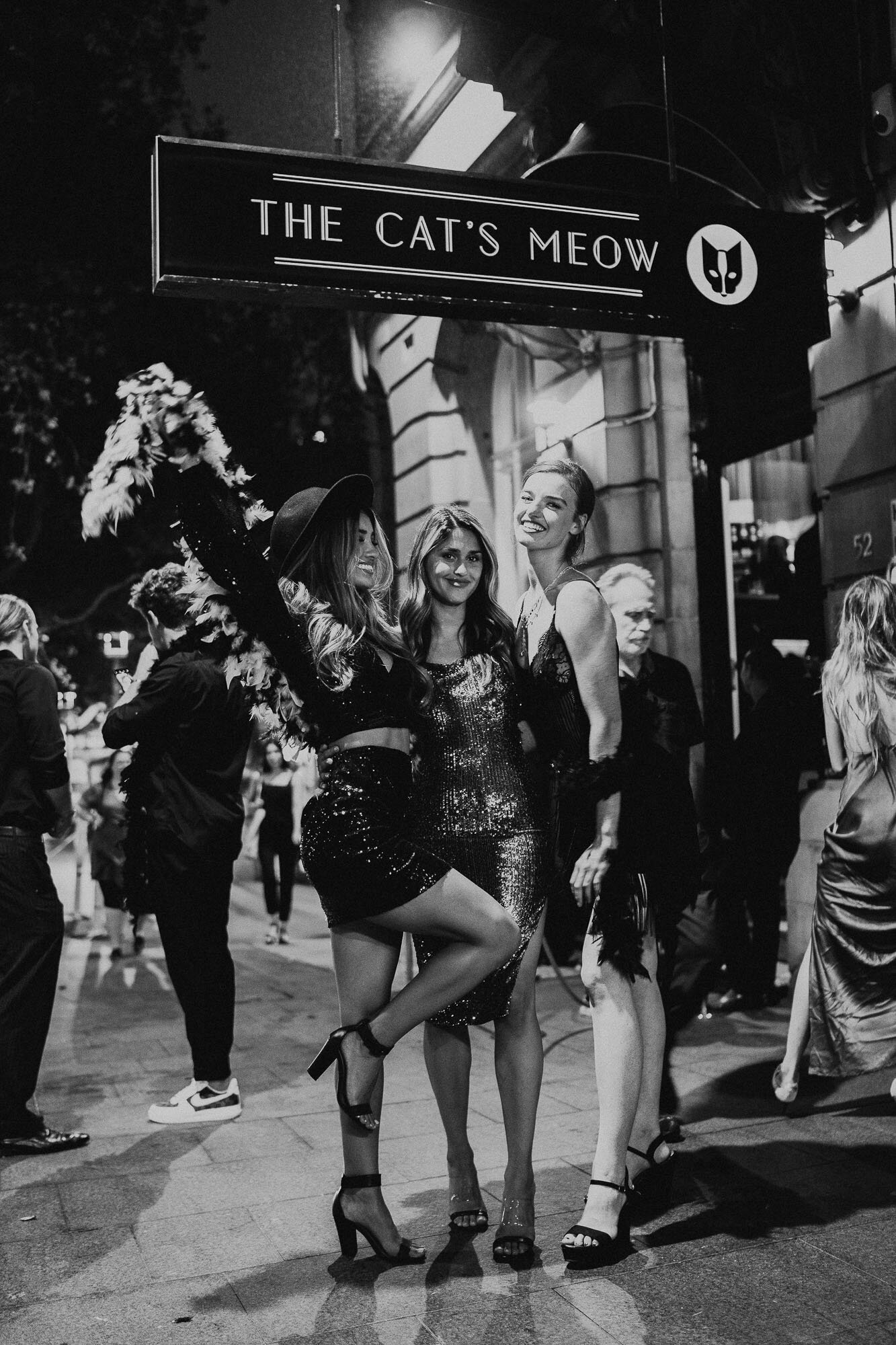 Photo of some people posing outside The Cat's Meow for a corporate event