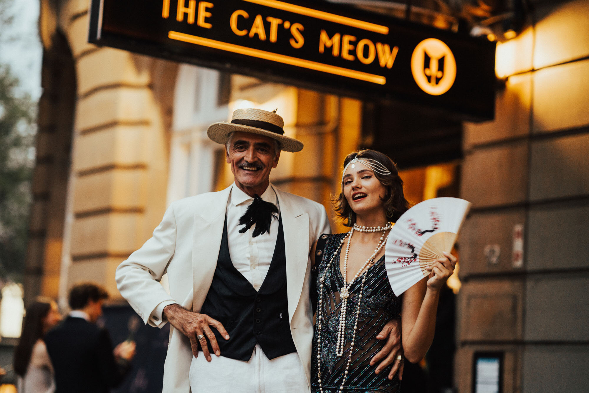 Photo of a man and woman outside The Cat's Meow for a corporate event