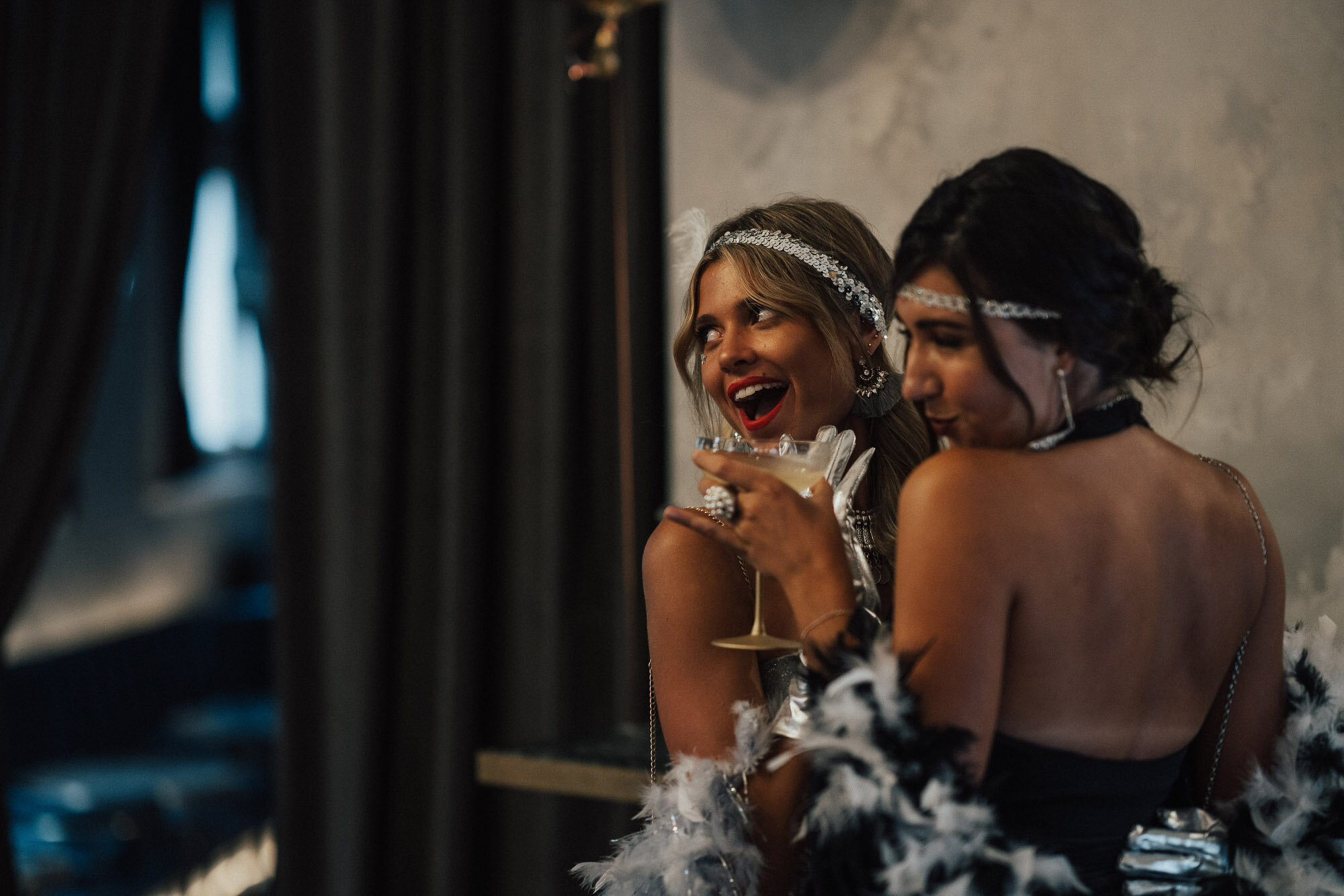 Women in fancy dress enjoying cocktails